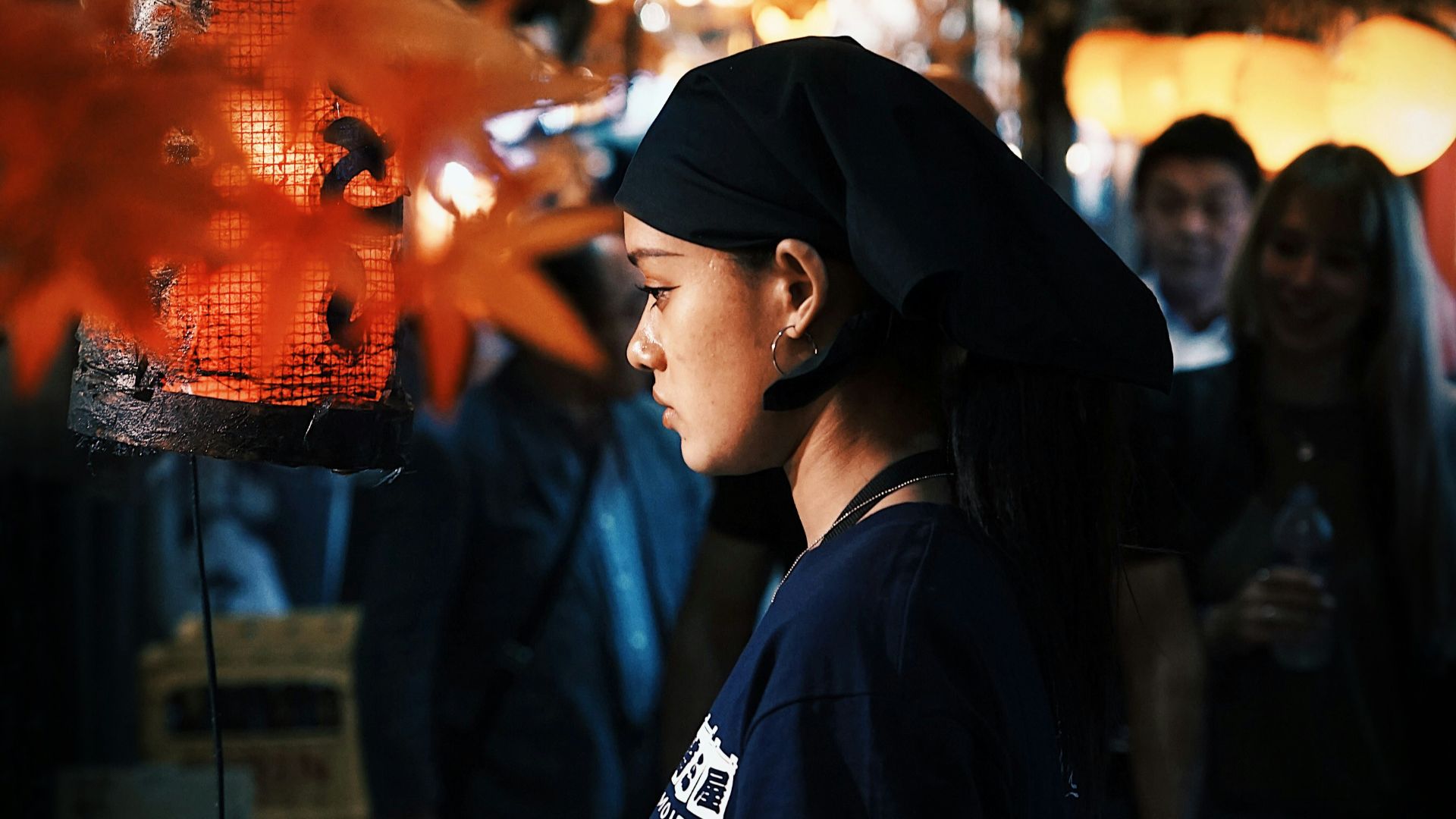 a woman holding a piece of paper in her hand