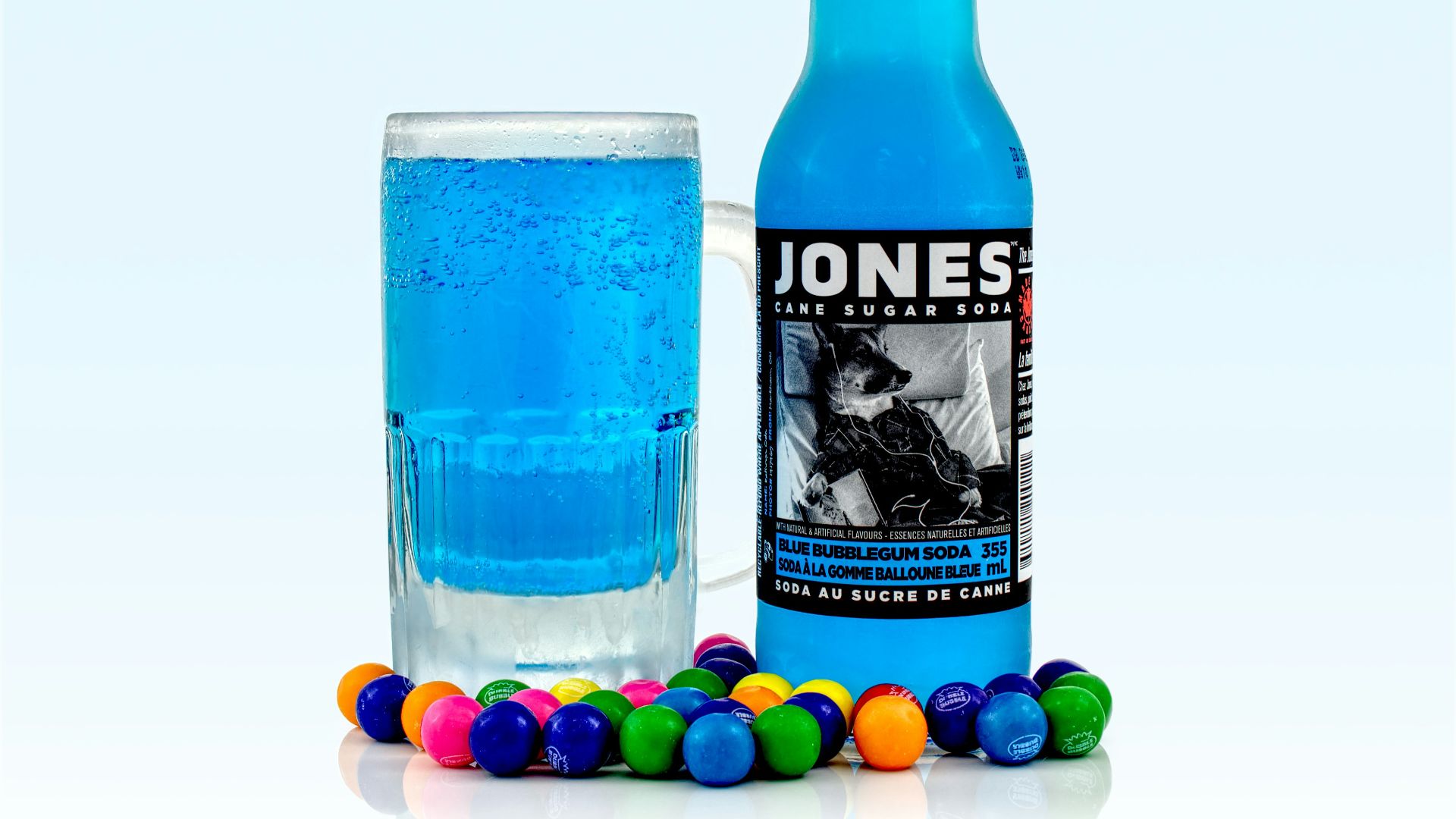 Jones liquor bottle beside glass