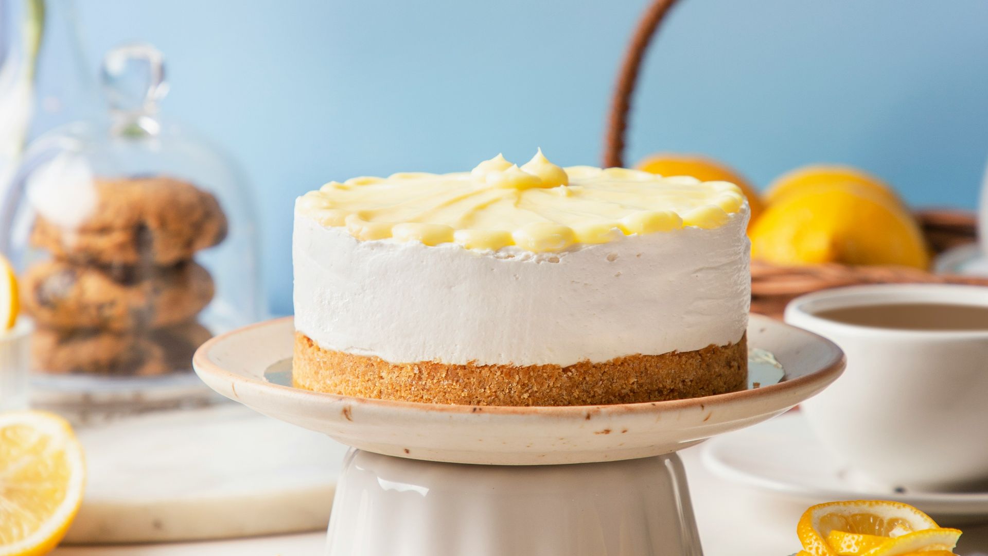 A cake sitting on top of a white cake plate