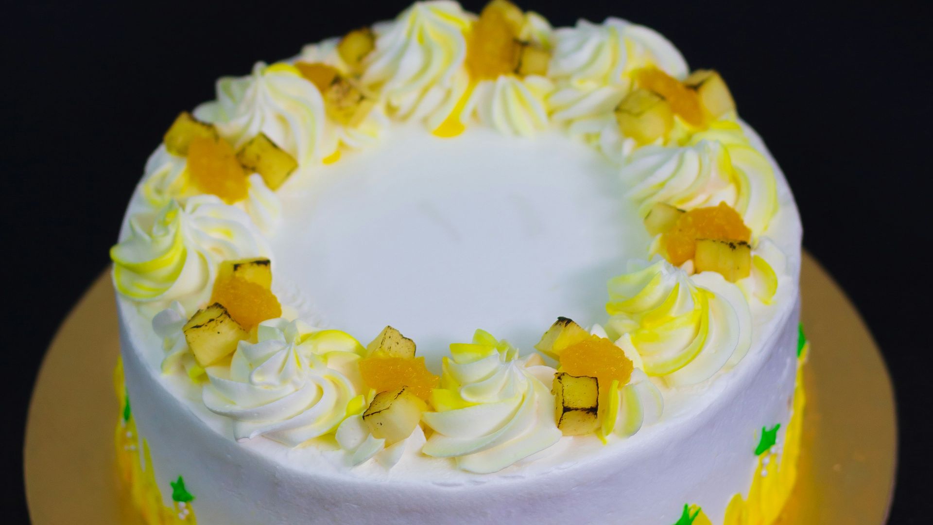 yellow and white cake on black surface