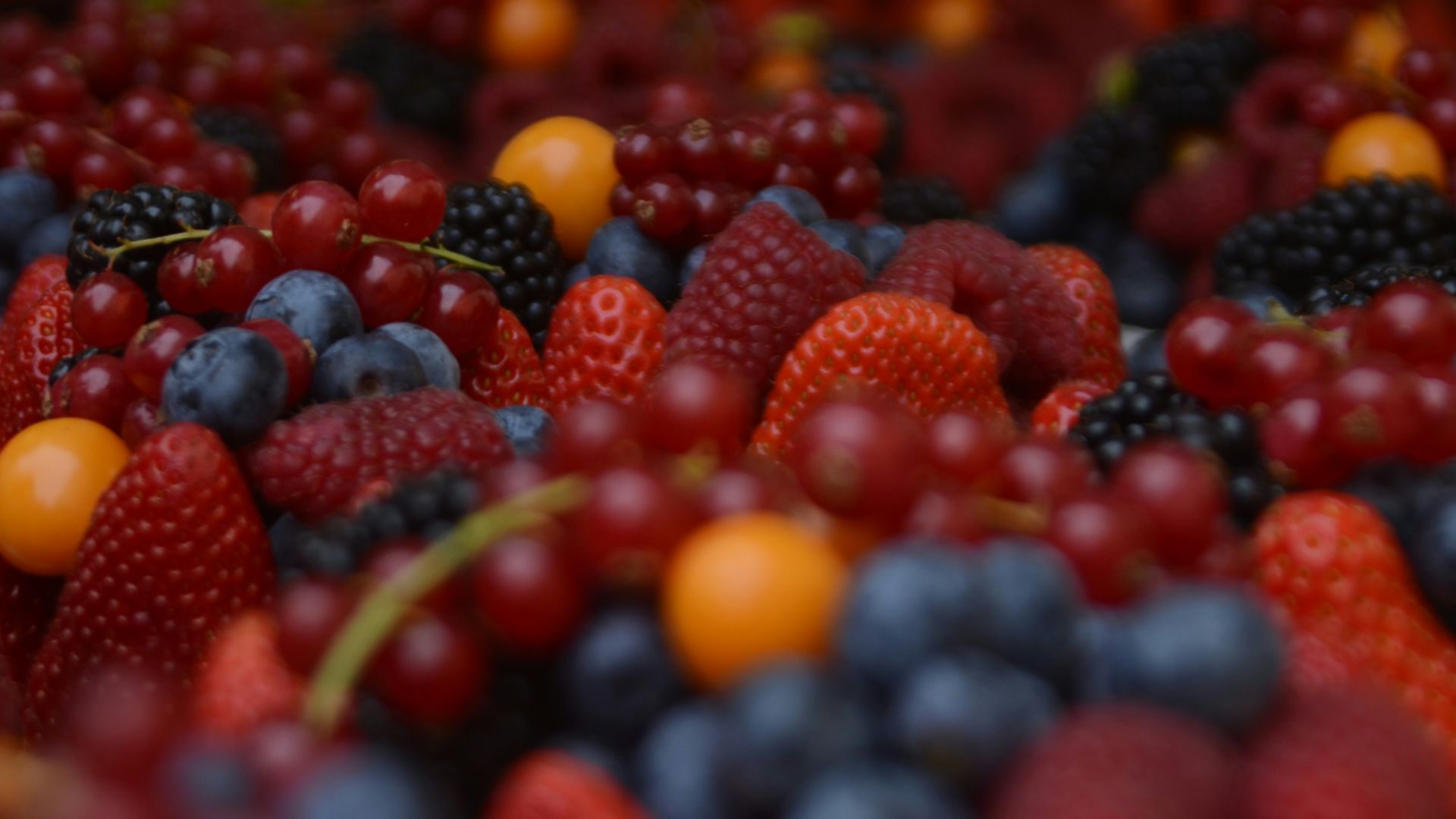 bunch of raspberry and grapes