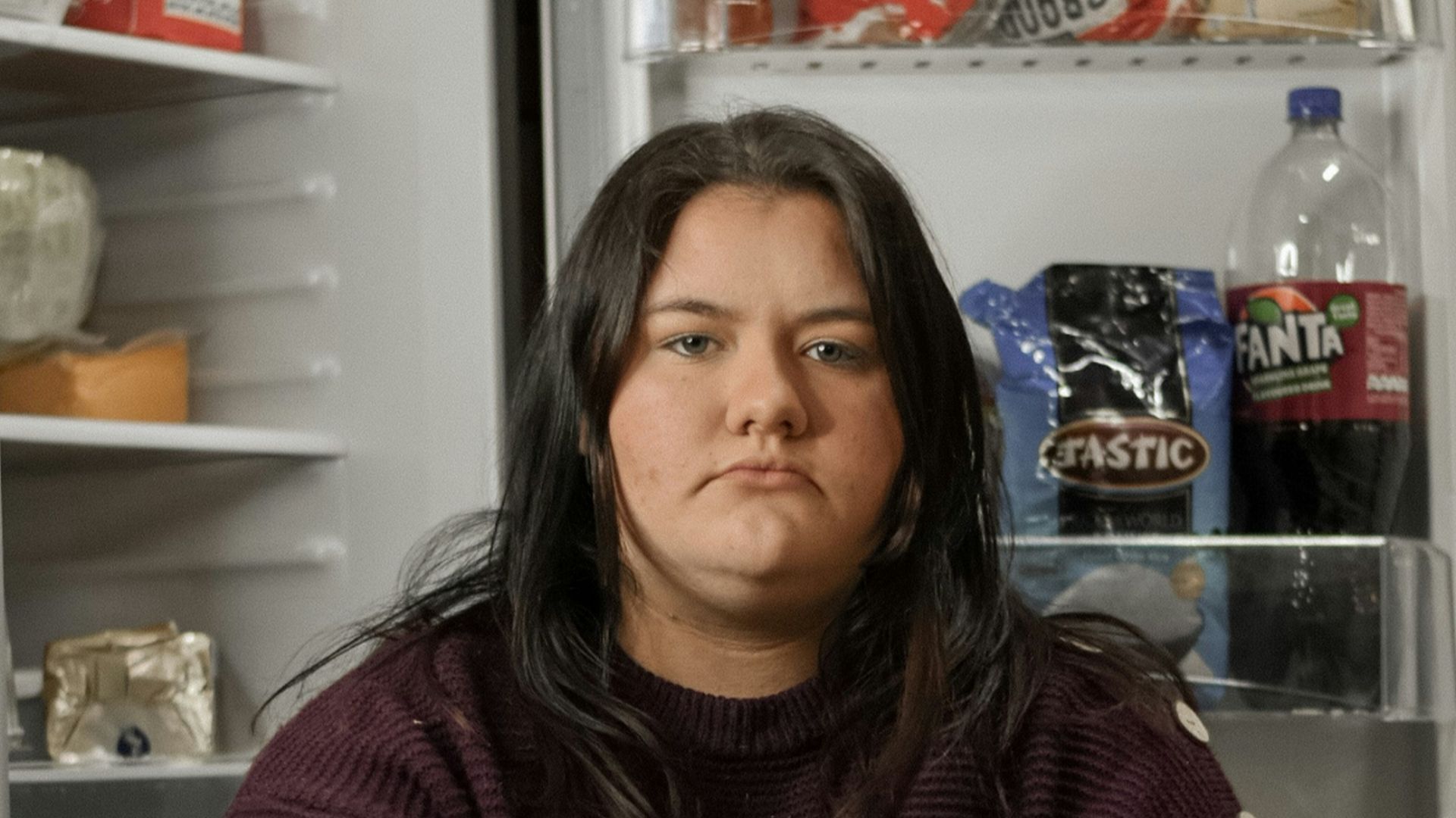 woman in red and black striped turtle neck sweater