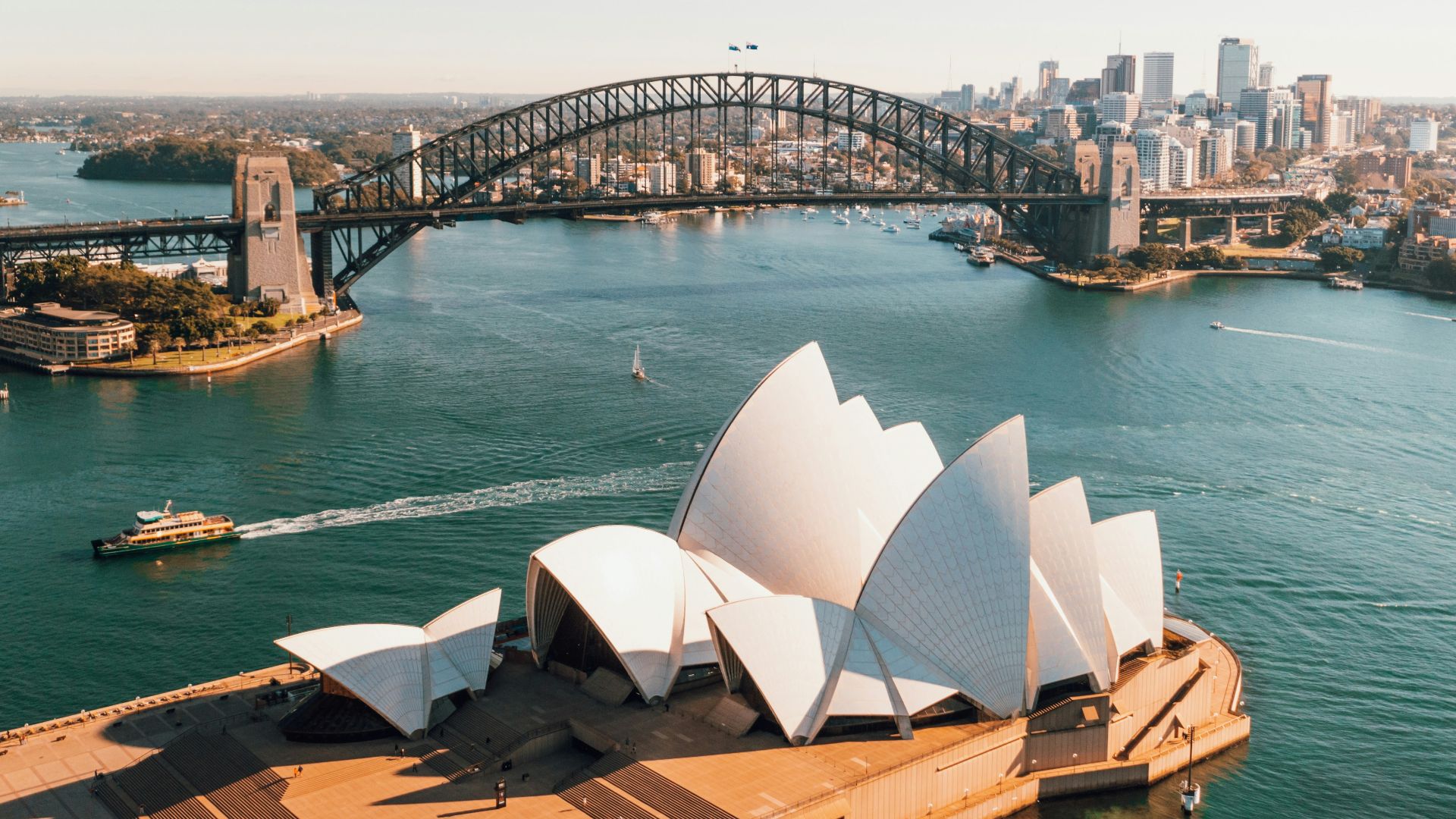 sydney opera house near body of water during daytime