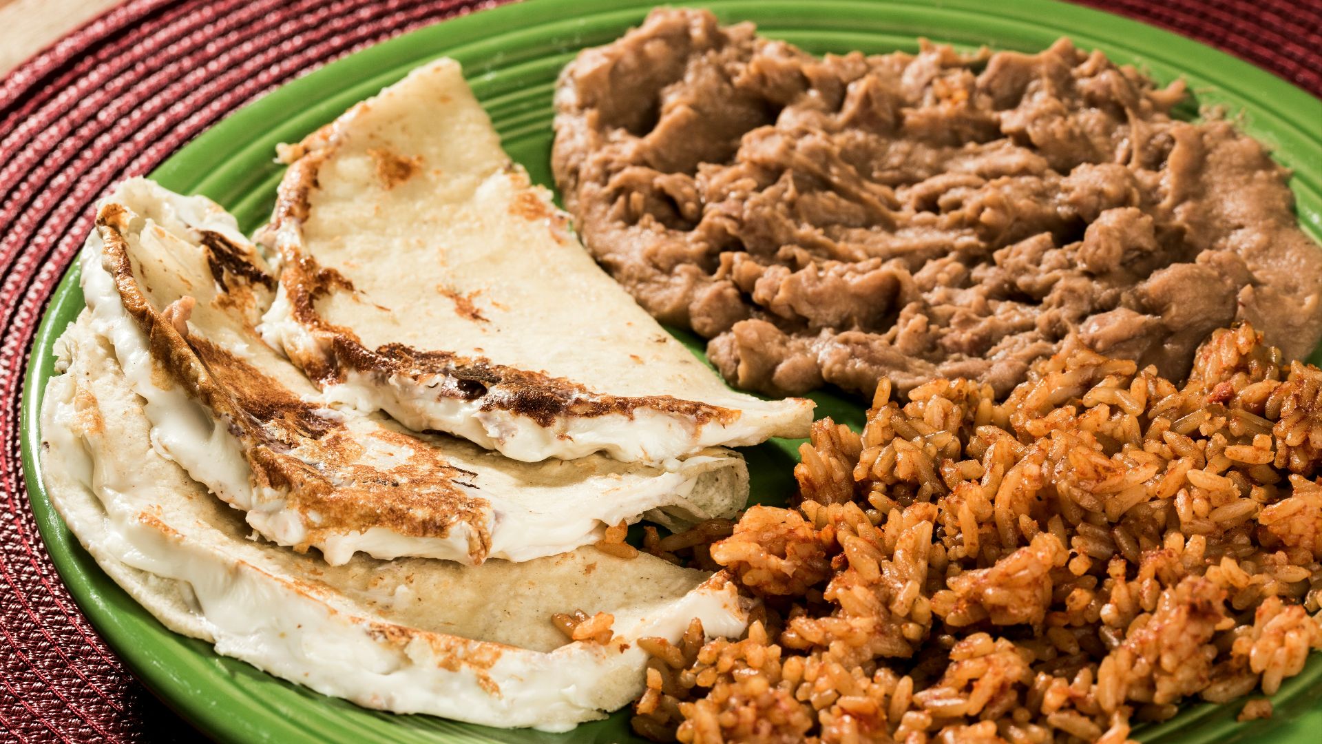 fried rice on green and white ceramic plate