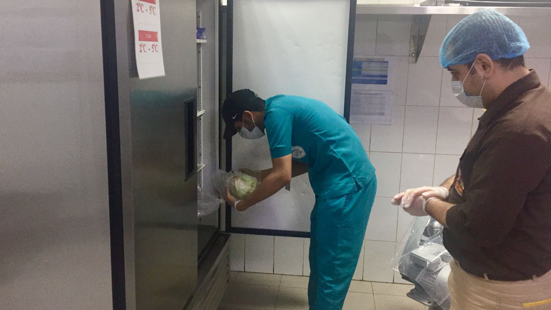 File:Health Inspector checking in a restaurant.jpg