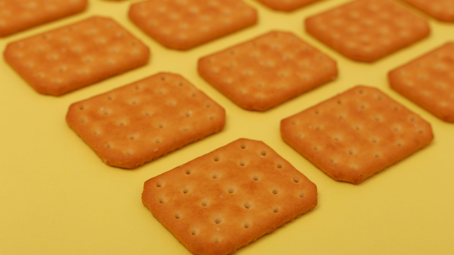 brown biscuits on yellow surface