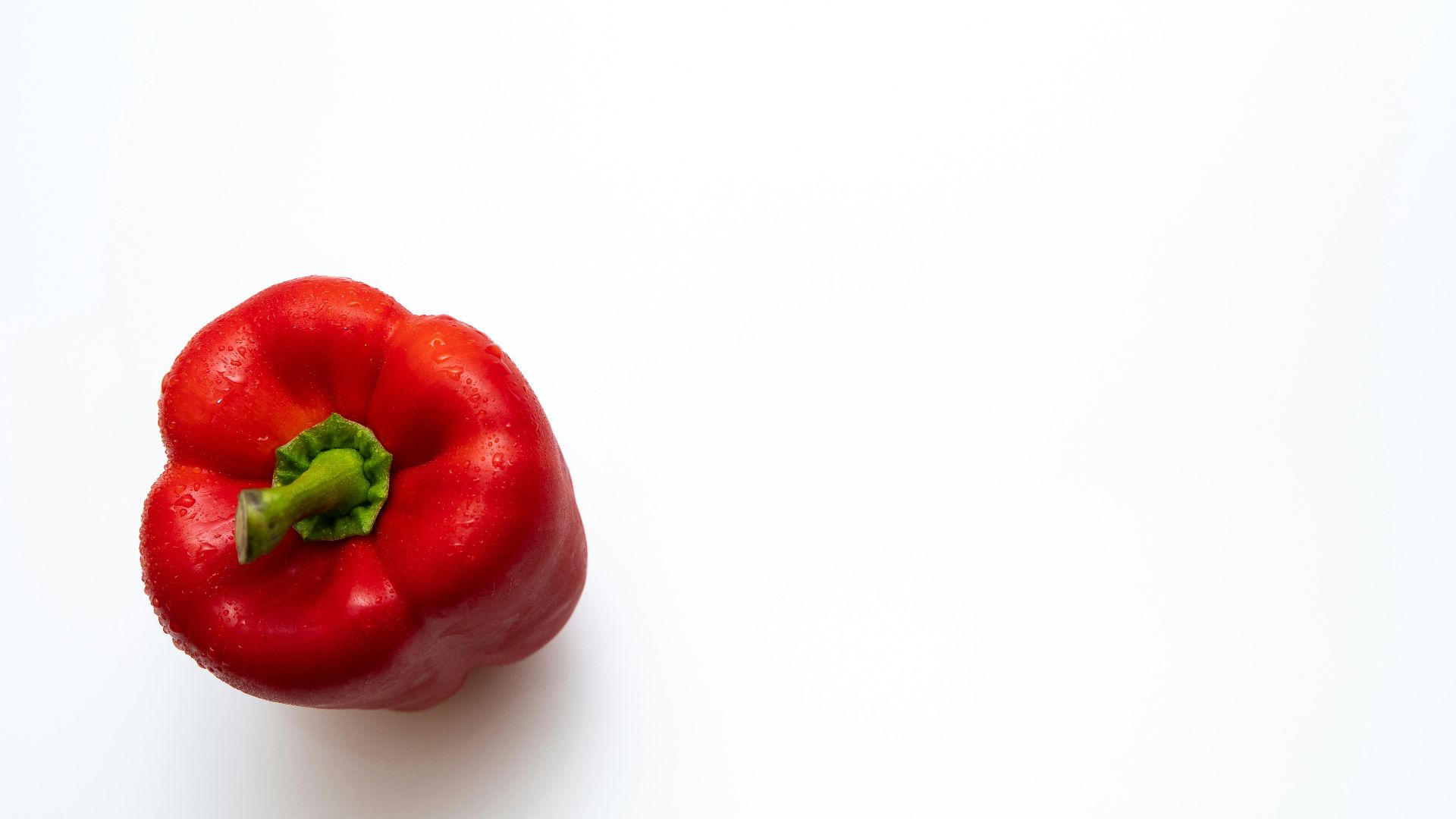 a red pepper on a white background