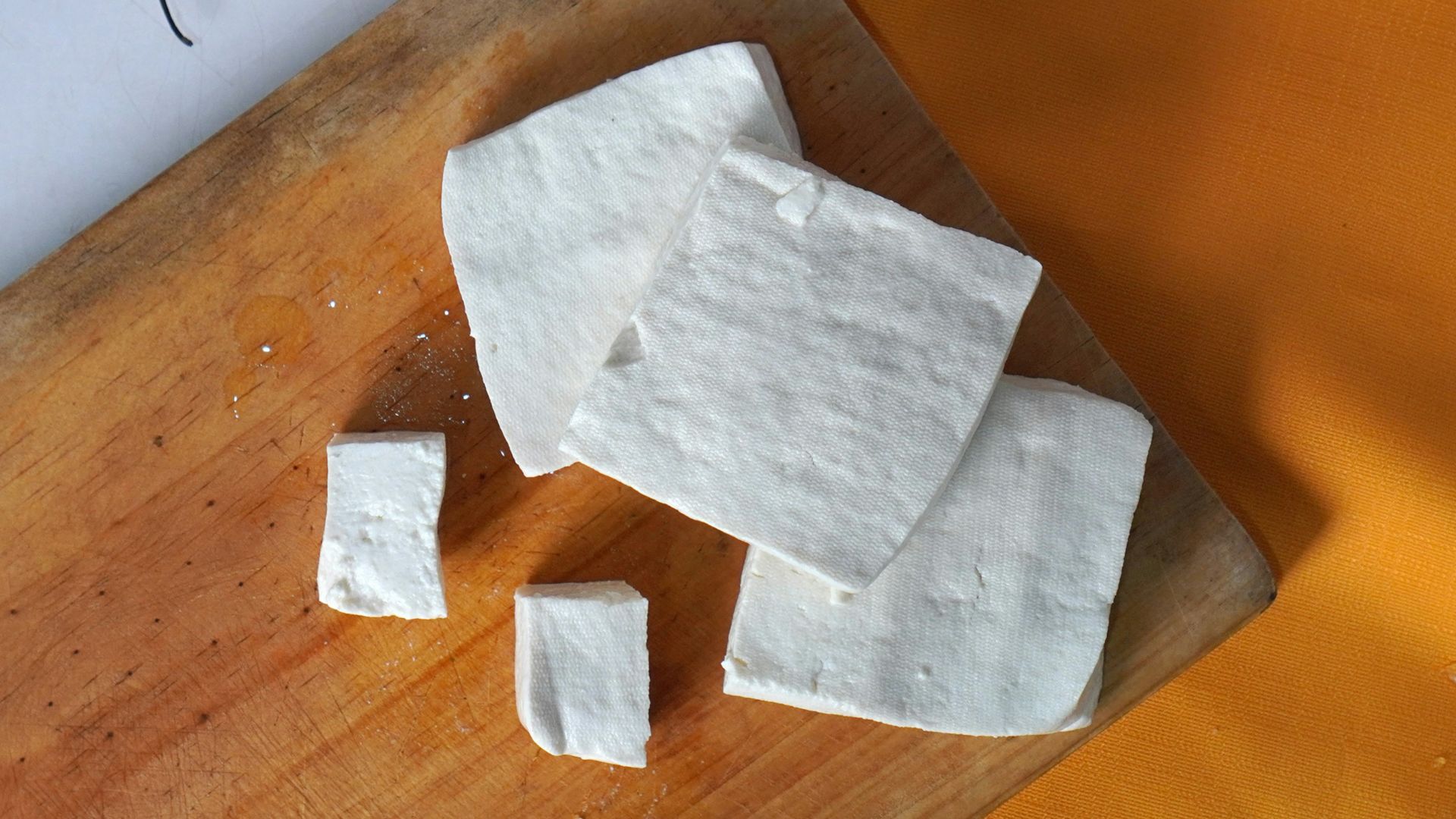 a white napkin on a cutting board