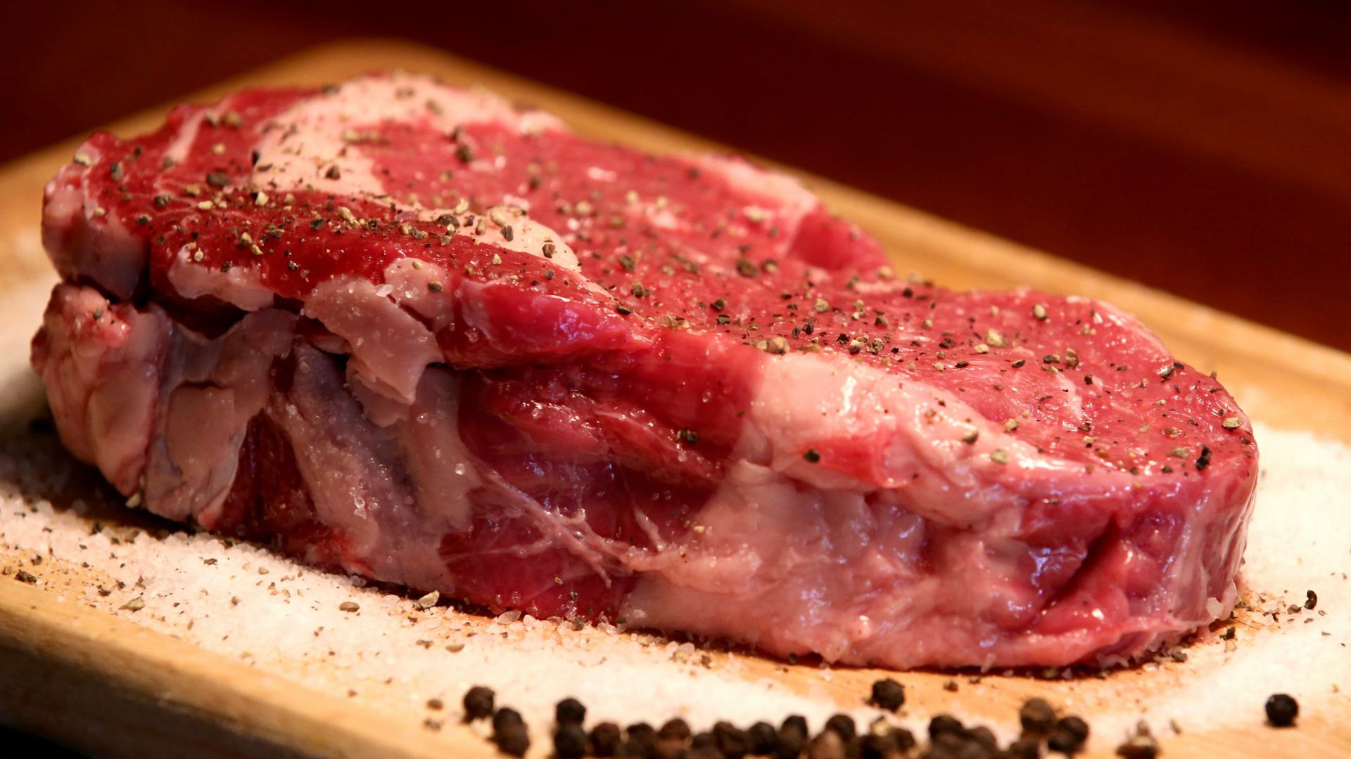 a piece of raw meat on a cutting board