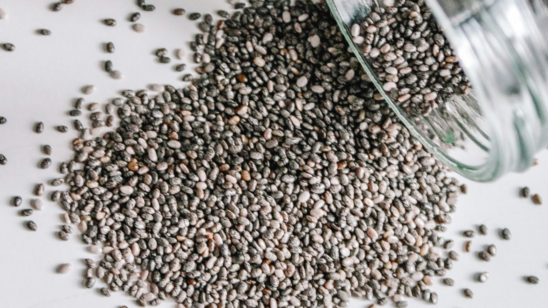 black beads in clear glass jar