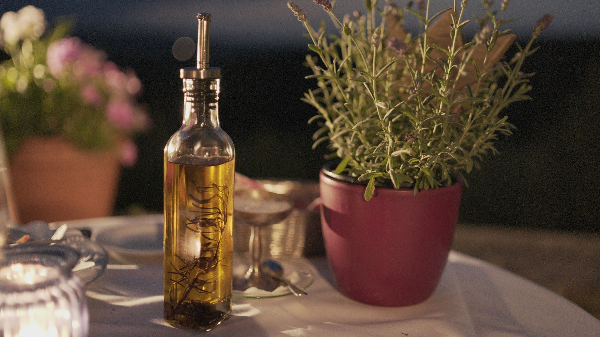 clear glass bottle beside plant