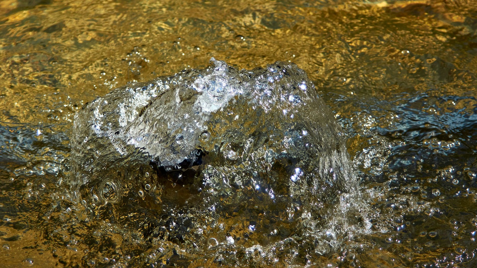 water splash on brown sand