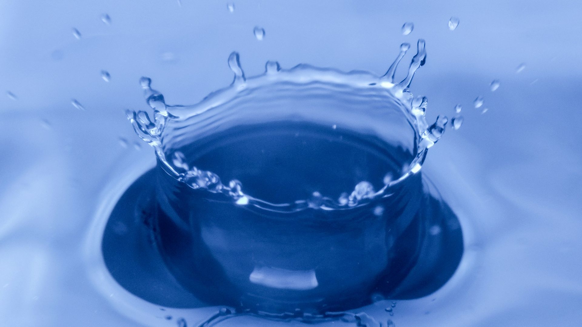 water drop on blue glass