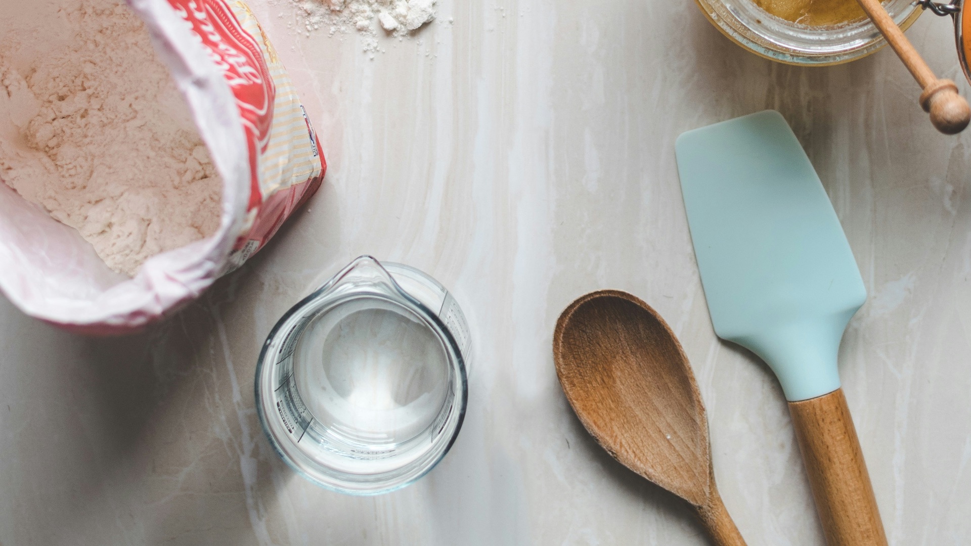 wooden ladle and spatula on top of table