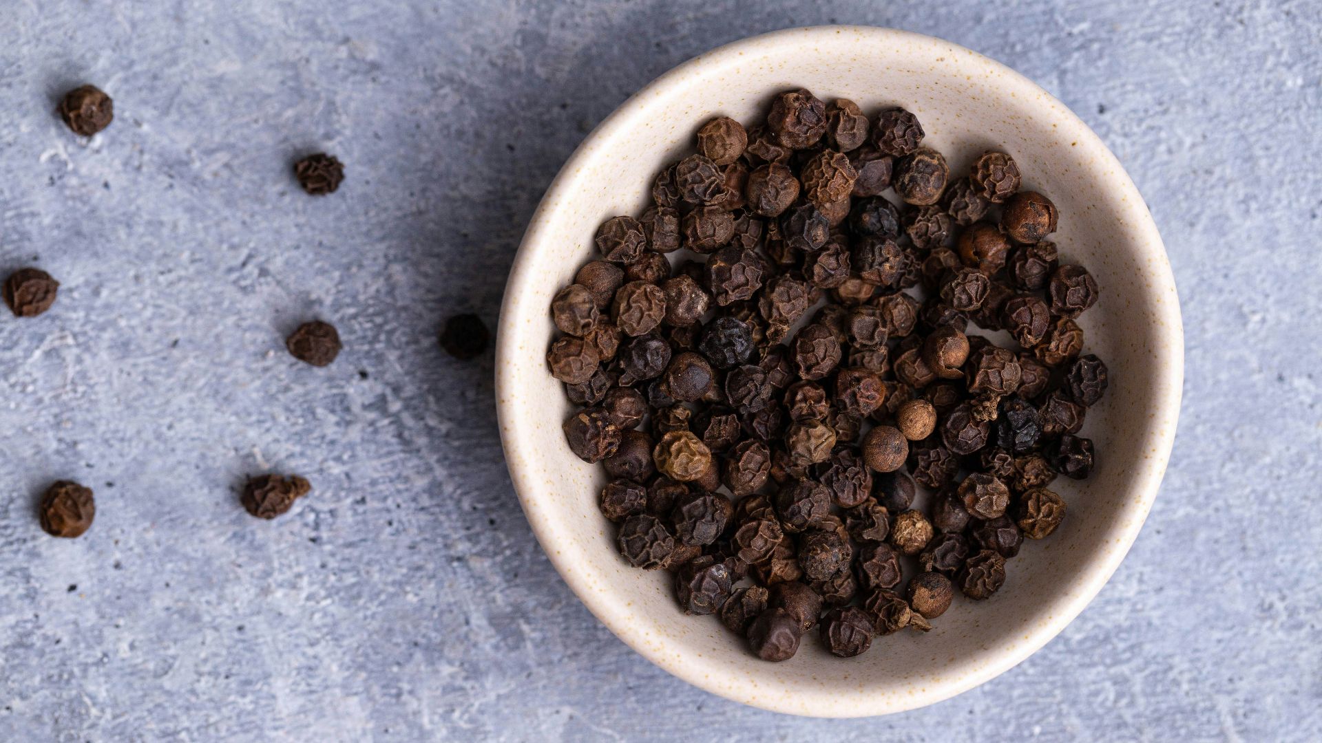 brown coffee beans on white ceramic bowl