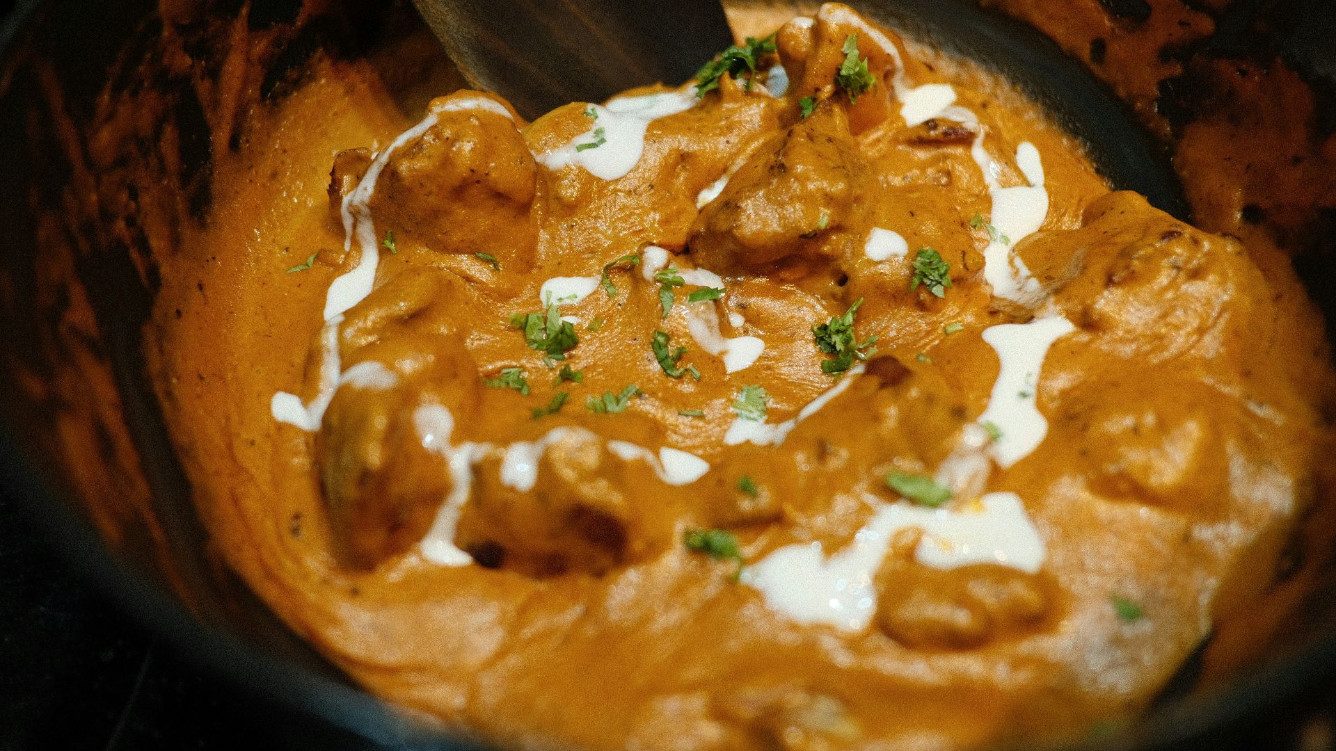 brown and green dish on brown wooden bowl