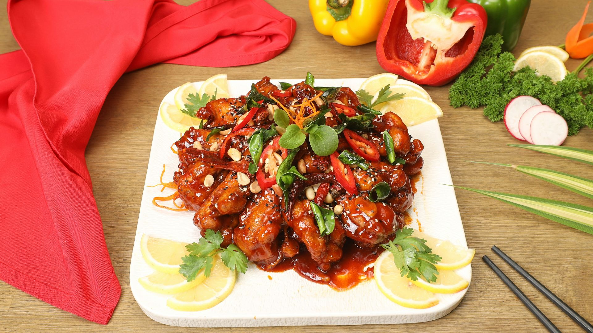 a white plate topped with meat covered in sauce