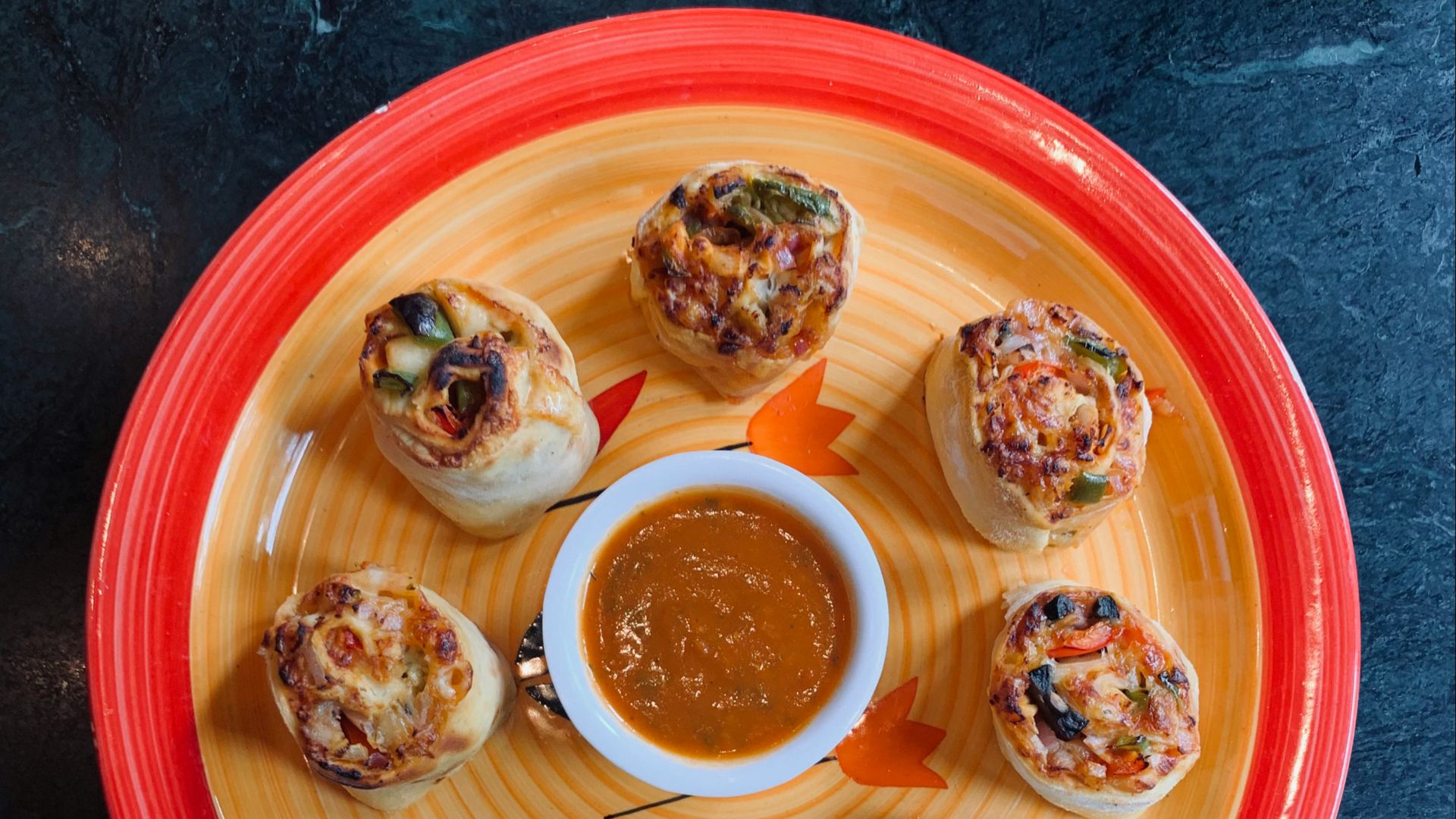 six cupcakes on red round plate