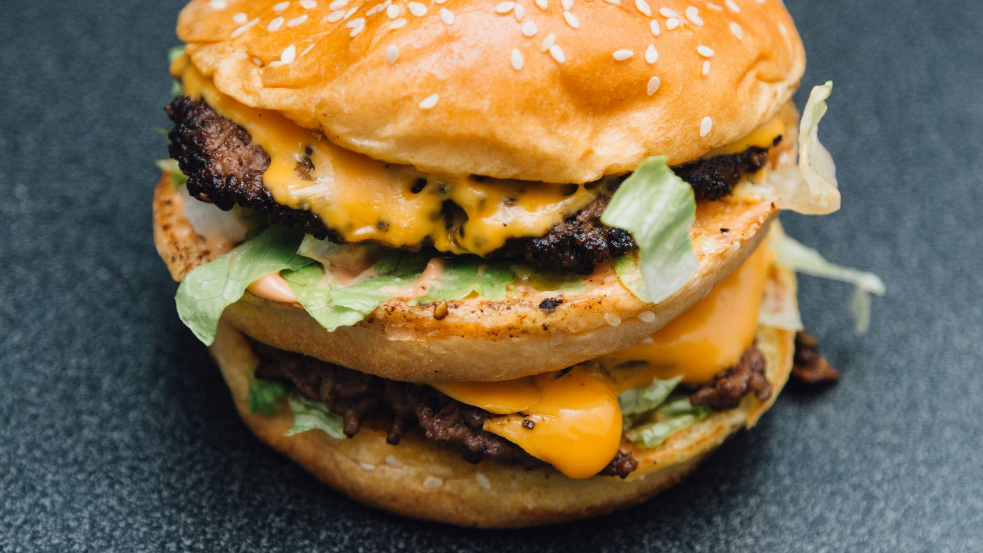 A hamburger sitting on top of a table
