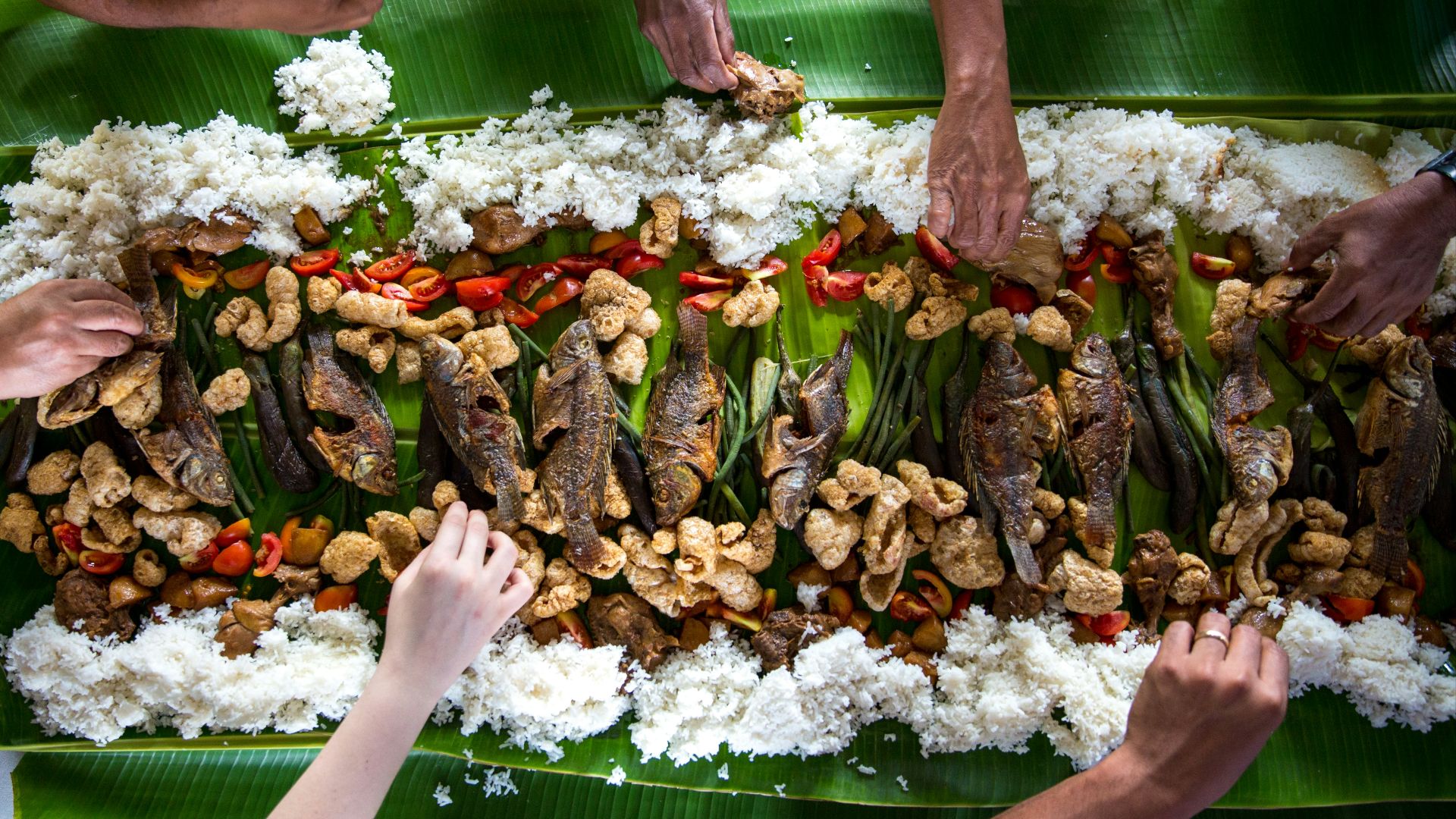 photo of people eating rice