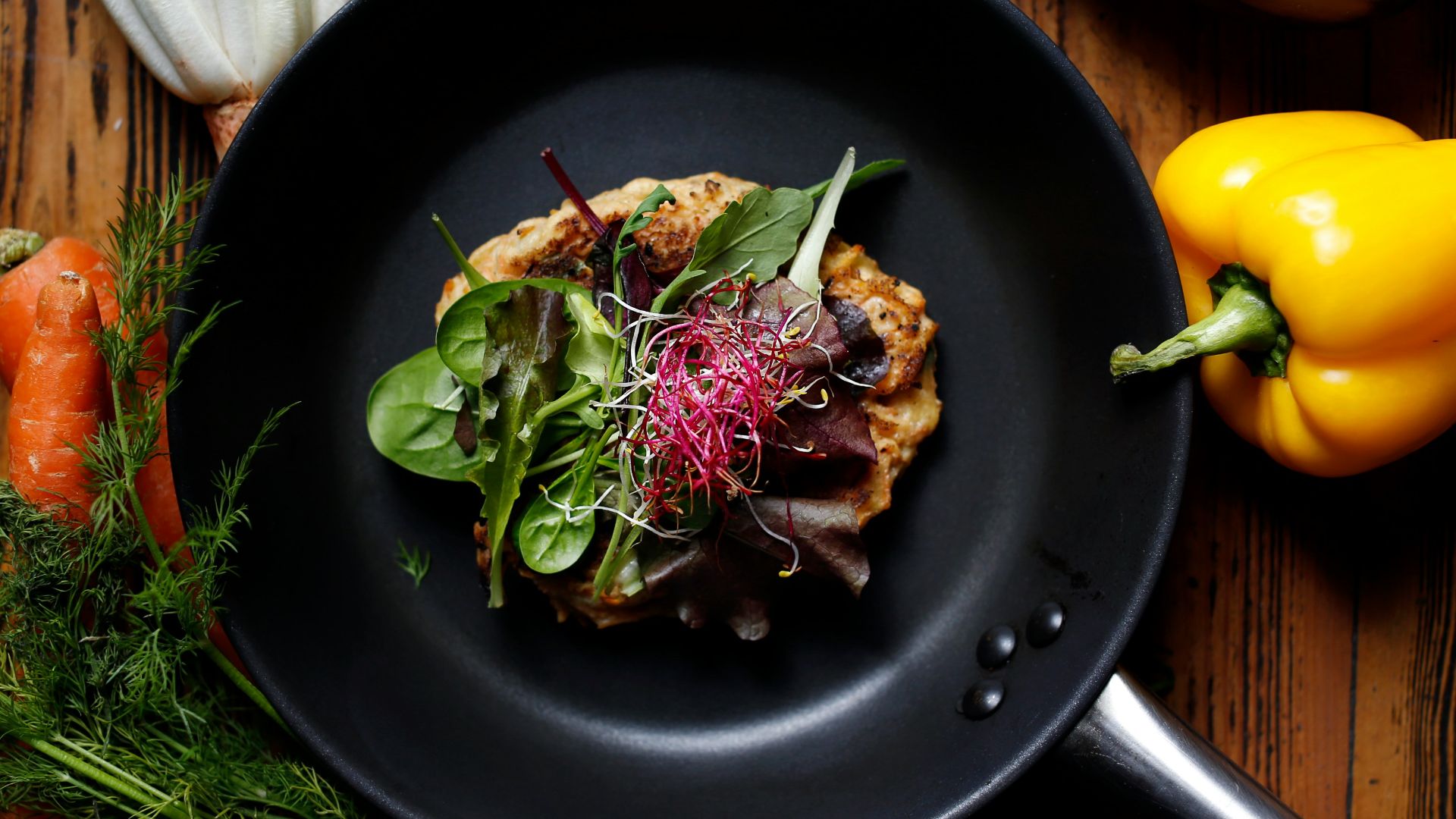 vegetable salad on black plate