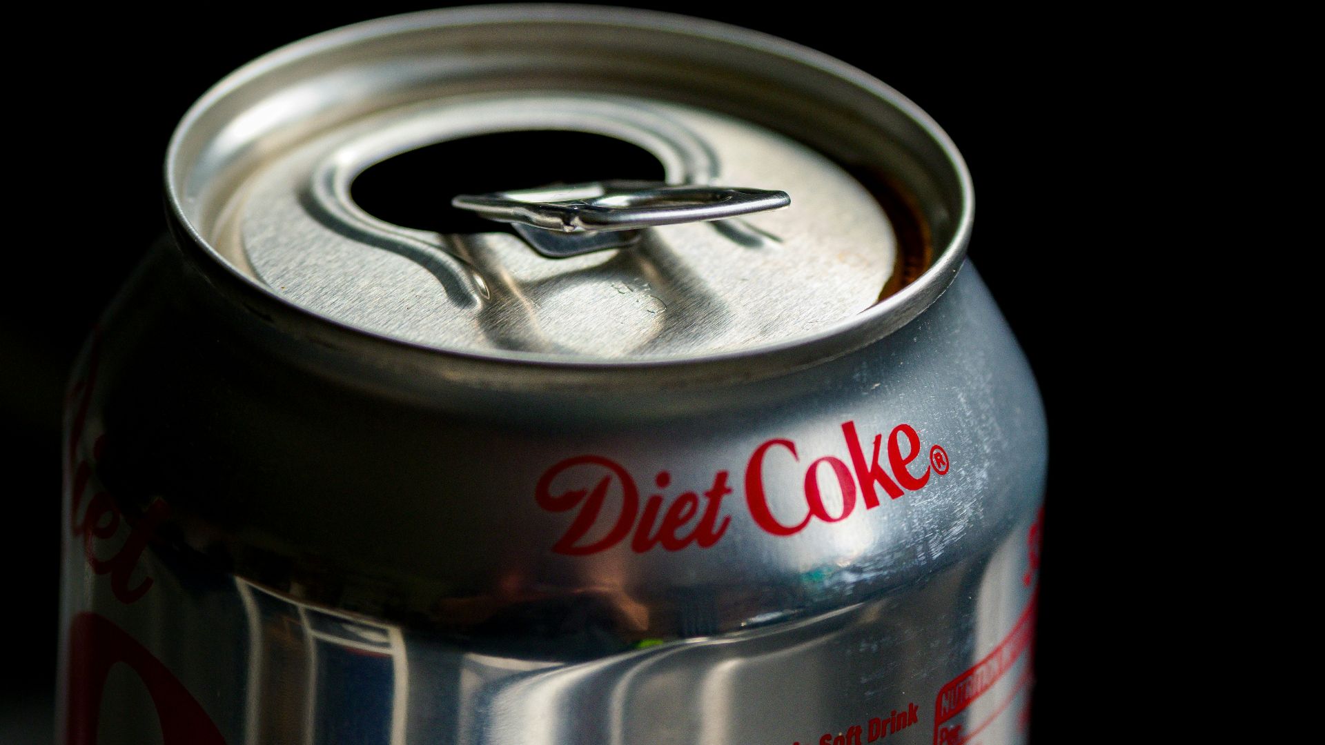 a can of diet coke sitting on a table