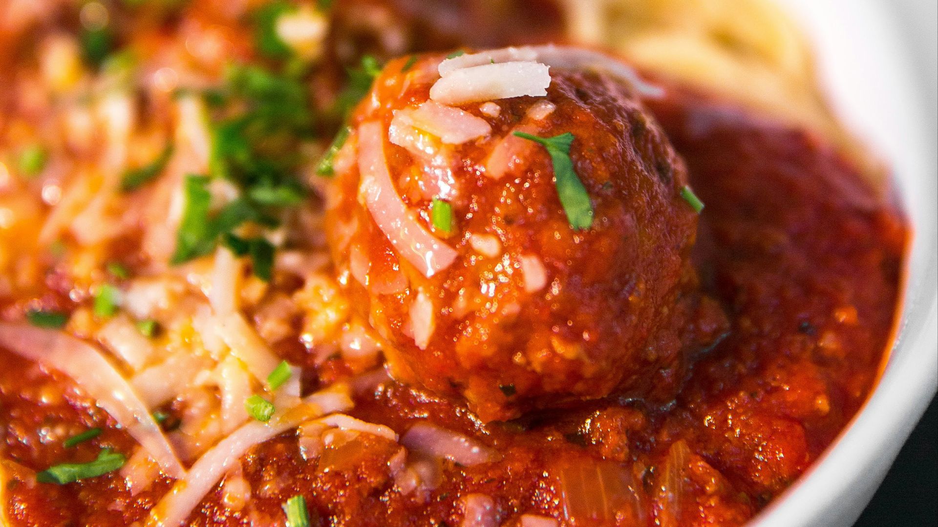 meta balls with noodles served on white ceramic bowl