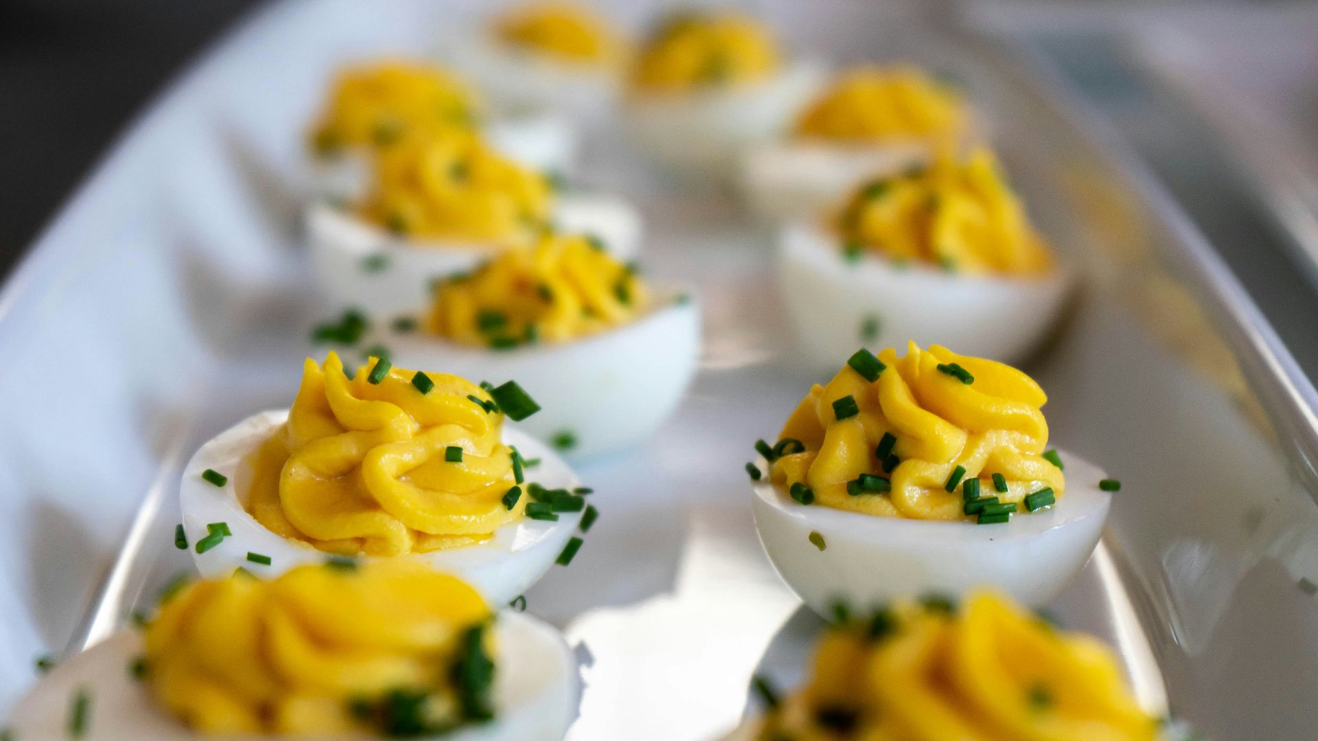 white and yellow icing covered cupcakes