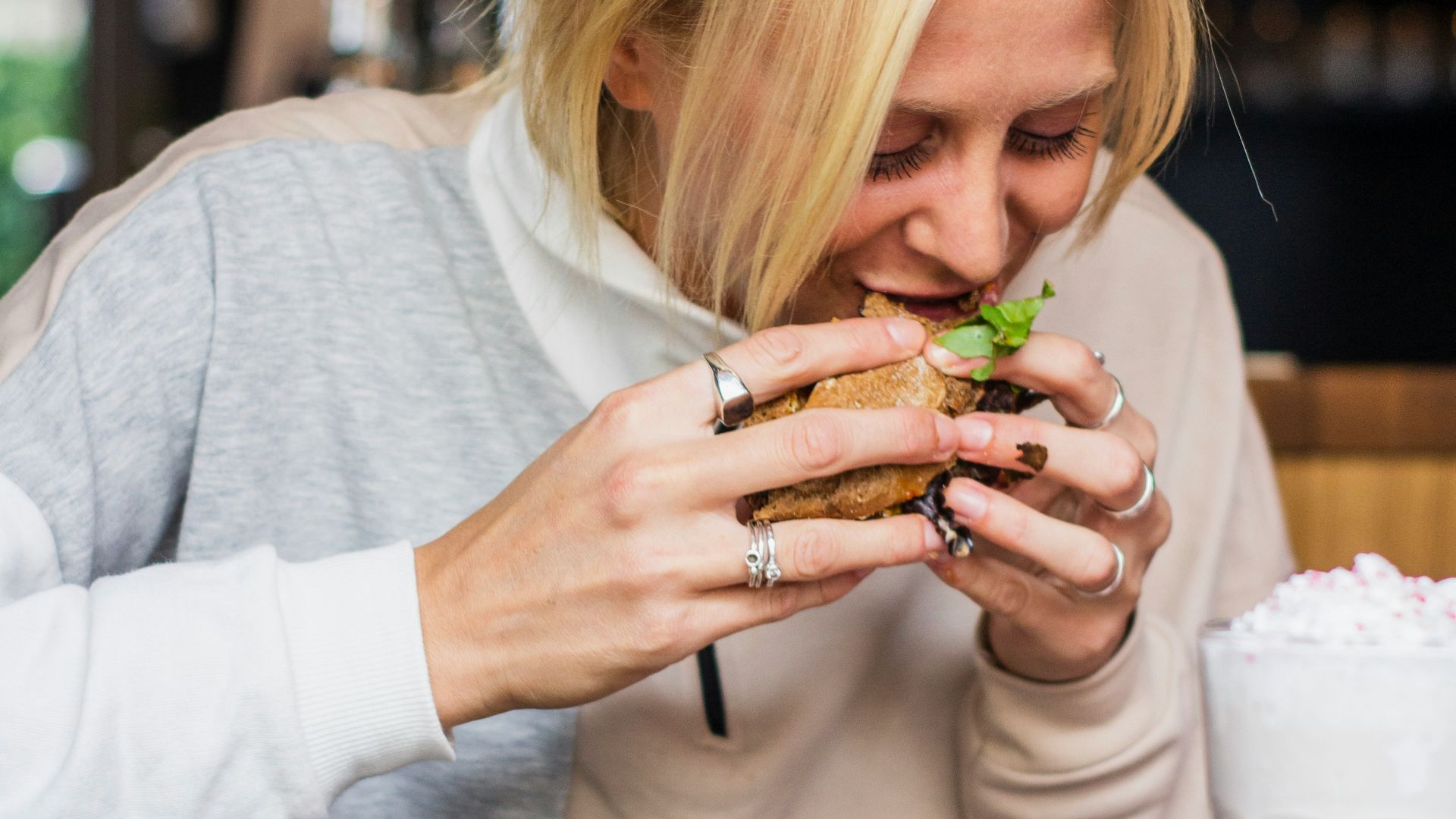 woman eating burger