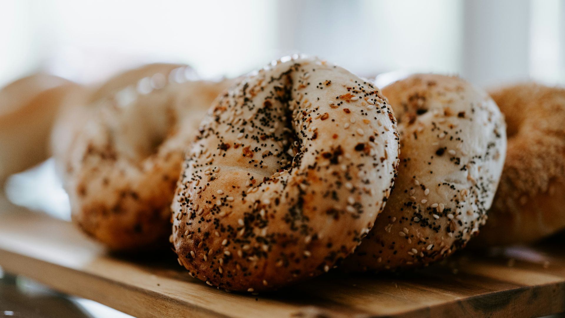 a close up of a tray of bagels