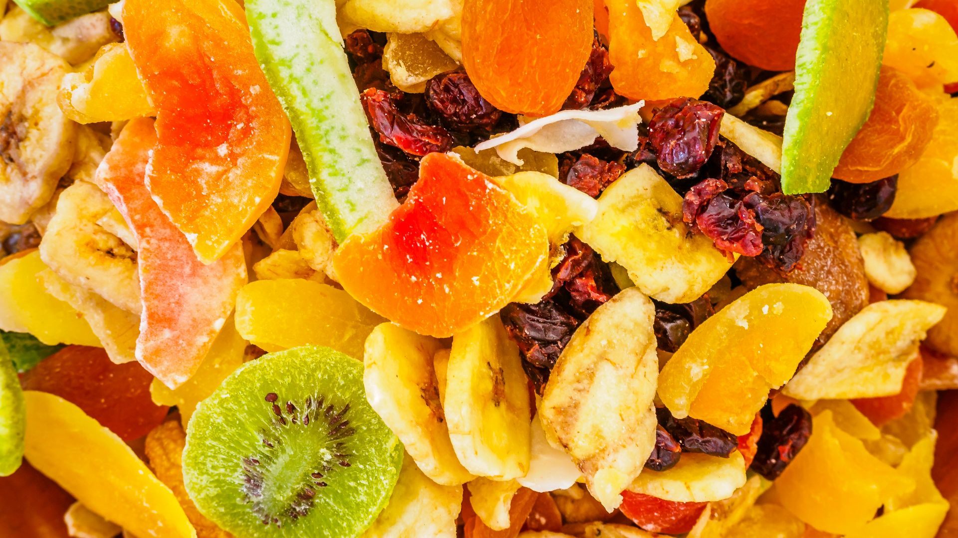 a close up of a mixture of fruit and nuts