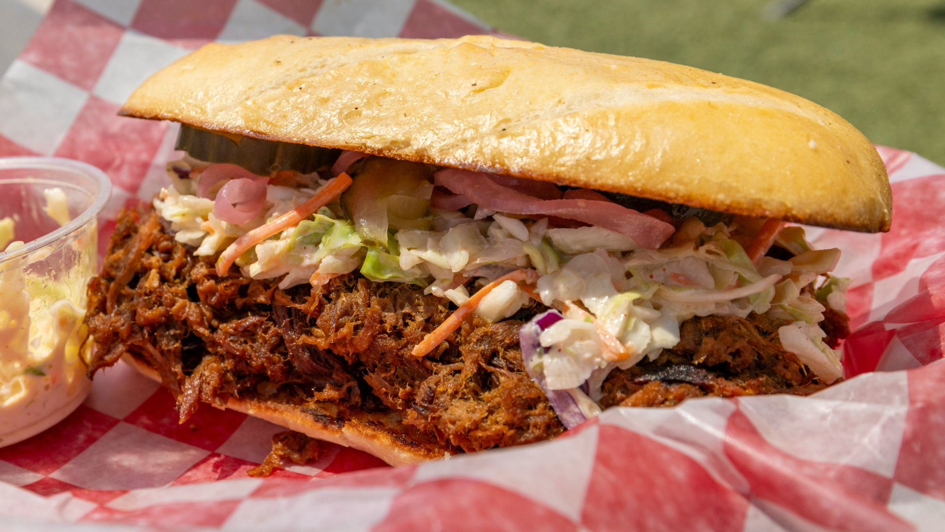 Pulled pork sandwich with coleslaw and pickles