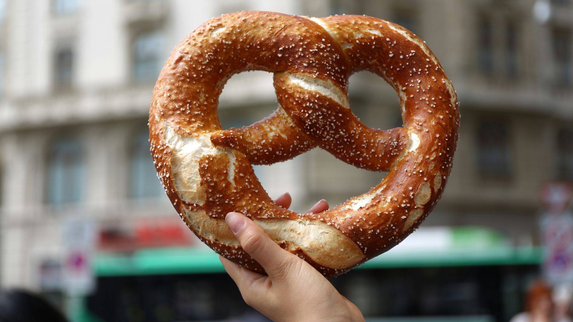 person holding pretzel