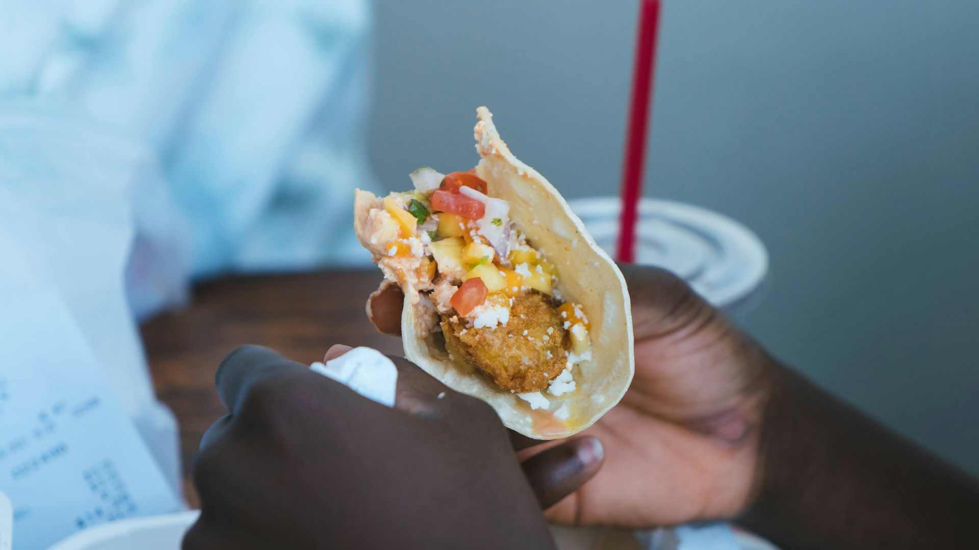 person holding white and brown food