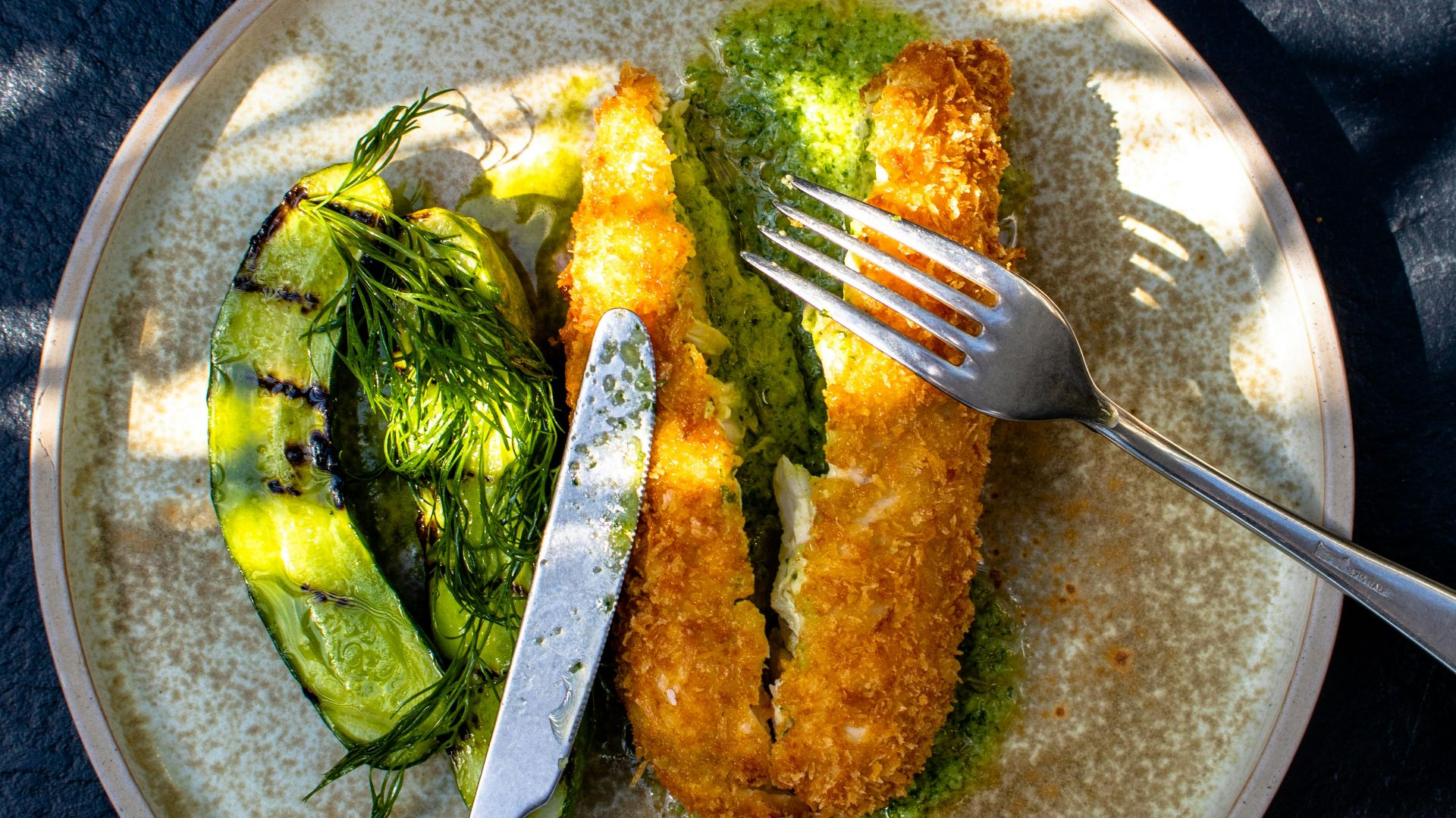 stainless steel fork on green and white ceramic plate