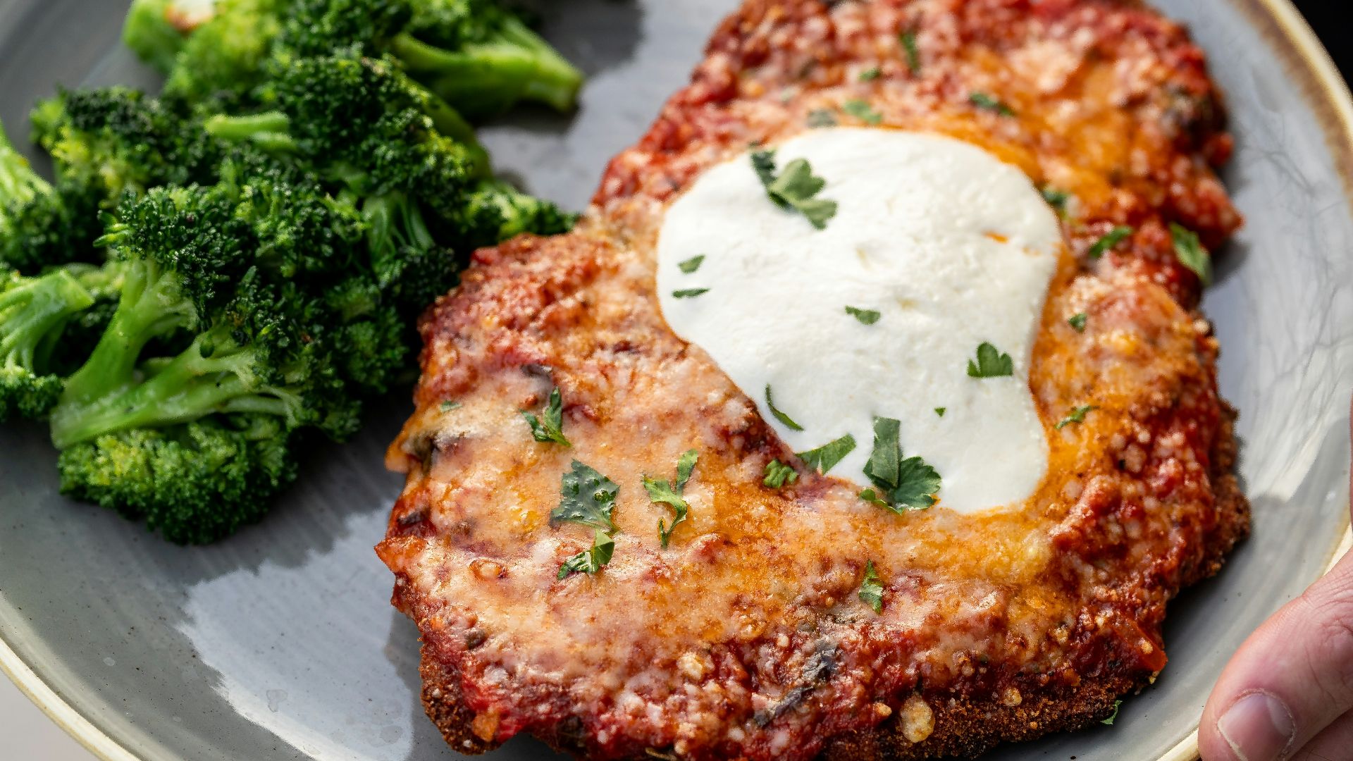 a plate of food with meat and broccoli