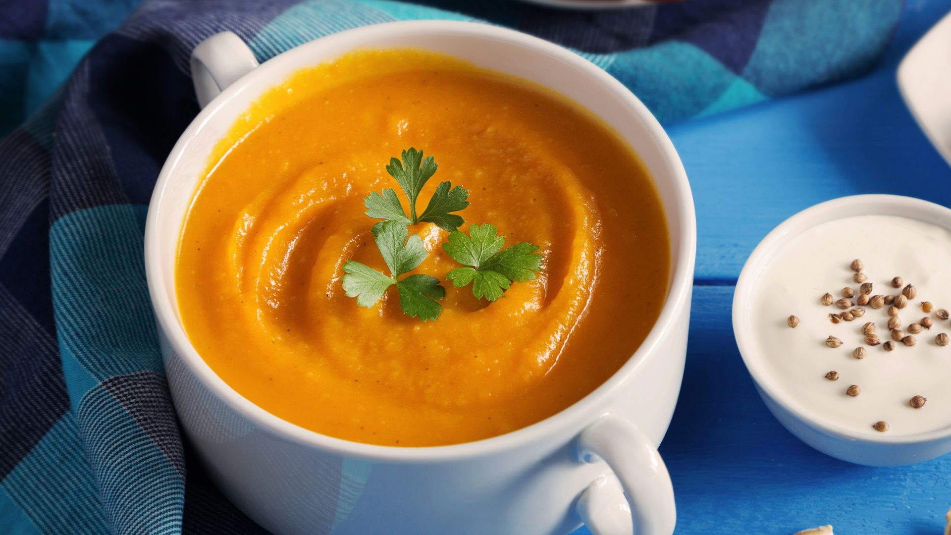 a cup of tea next to a plate of pastries