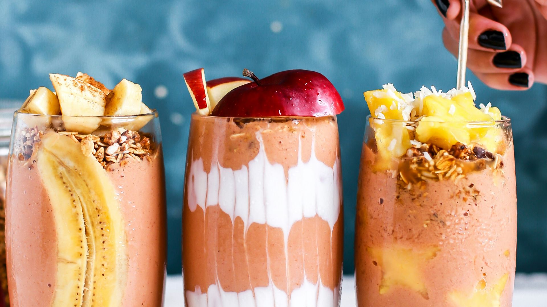 three clear drinking glass filled by shakes