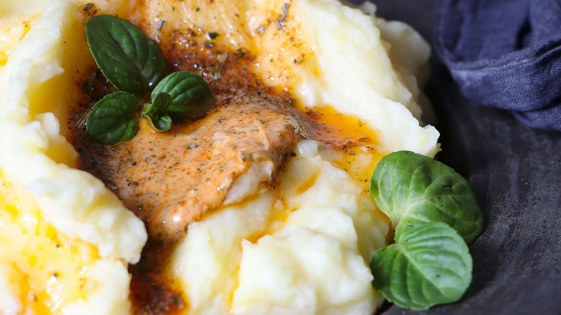 a plate of mashed potatoes topped with gravy