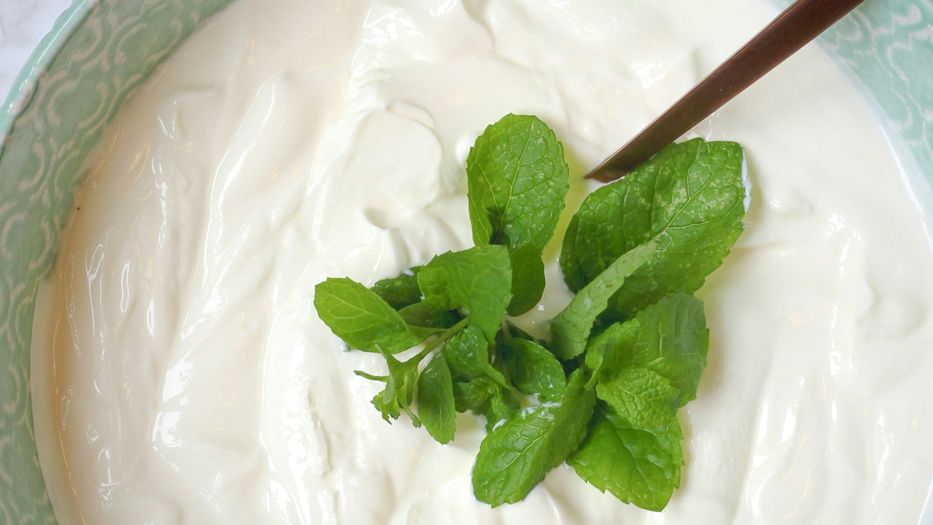 a bowl of yogurt with a spoon in it
