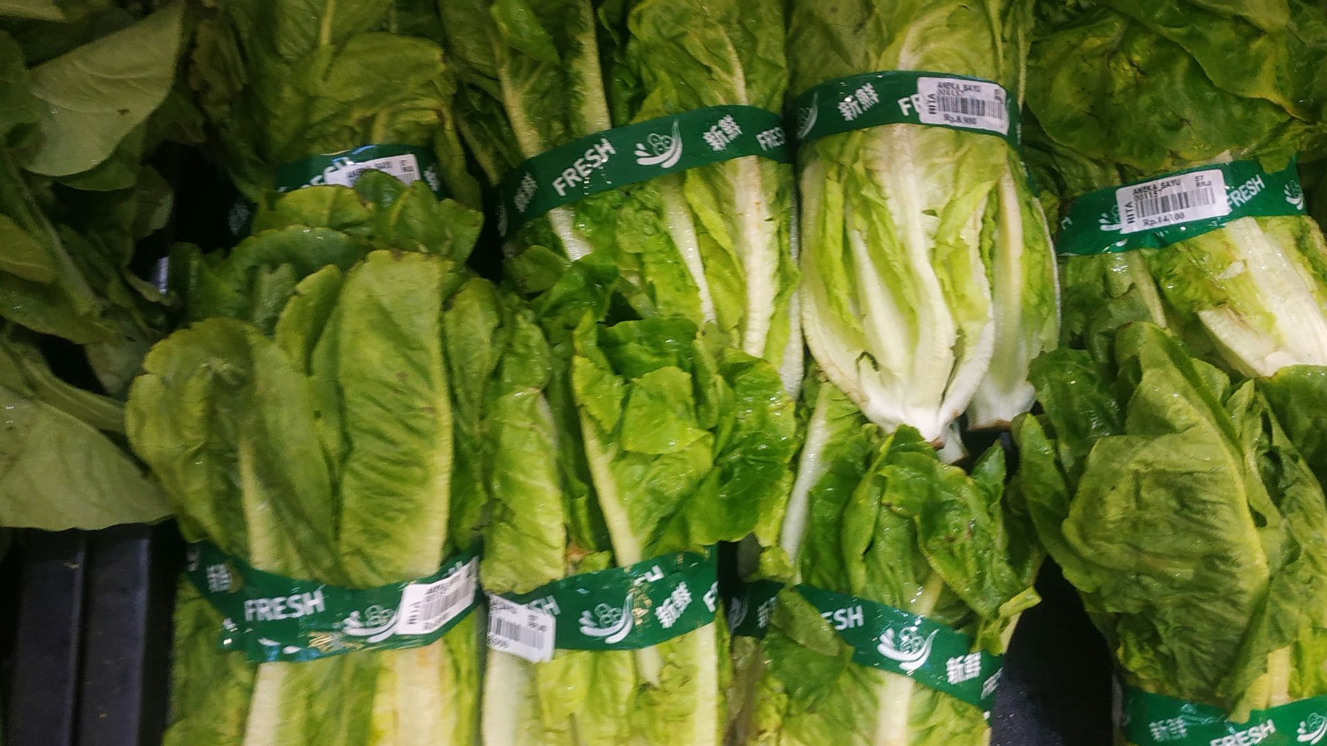 a group of bags of green vegetables
