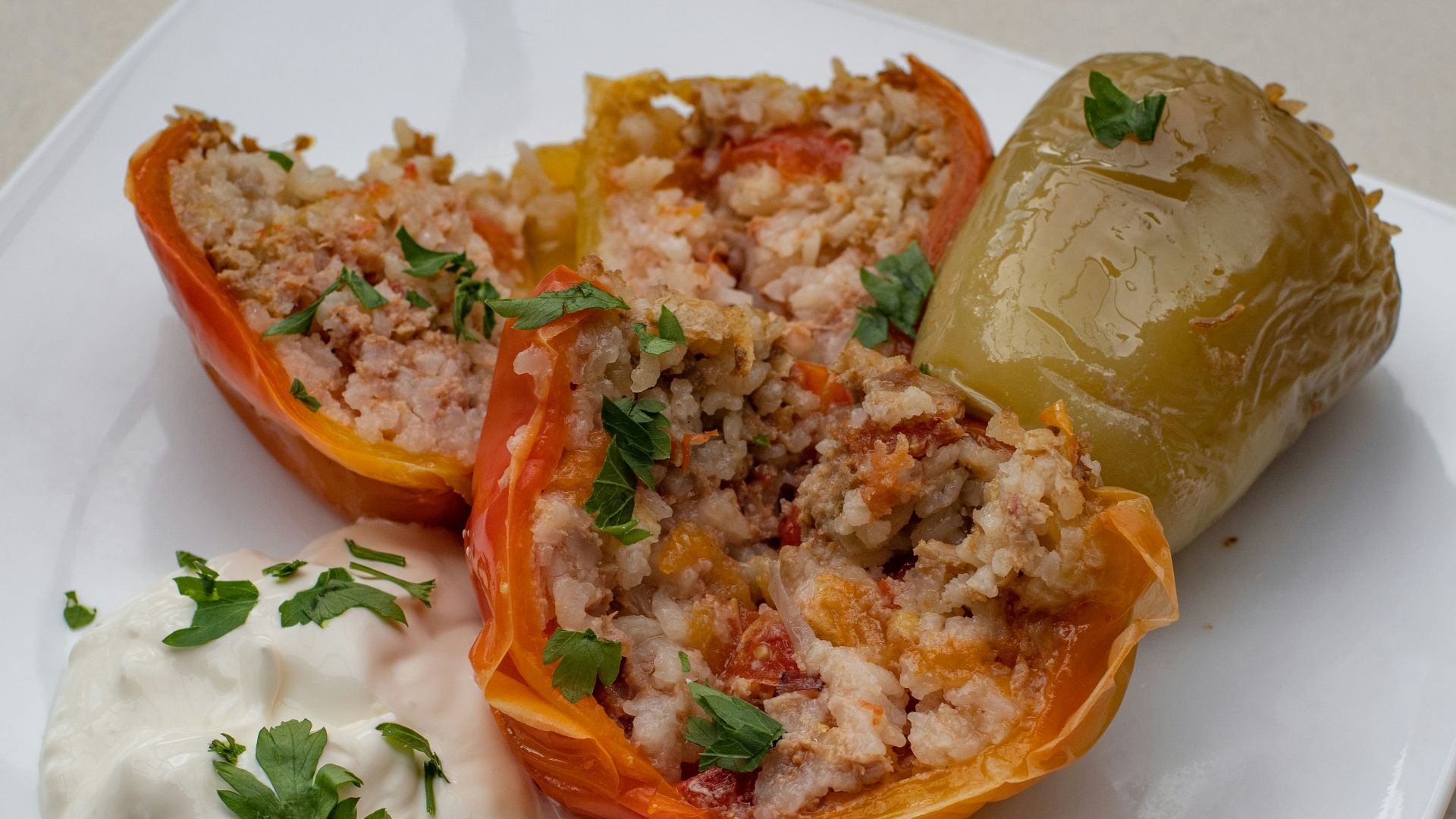 a white plate topped with stuffed bell peppers