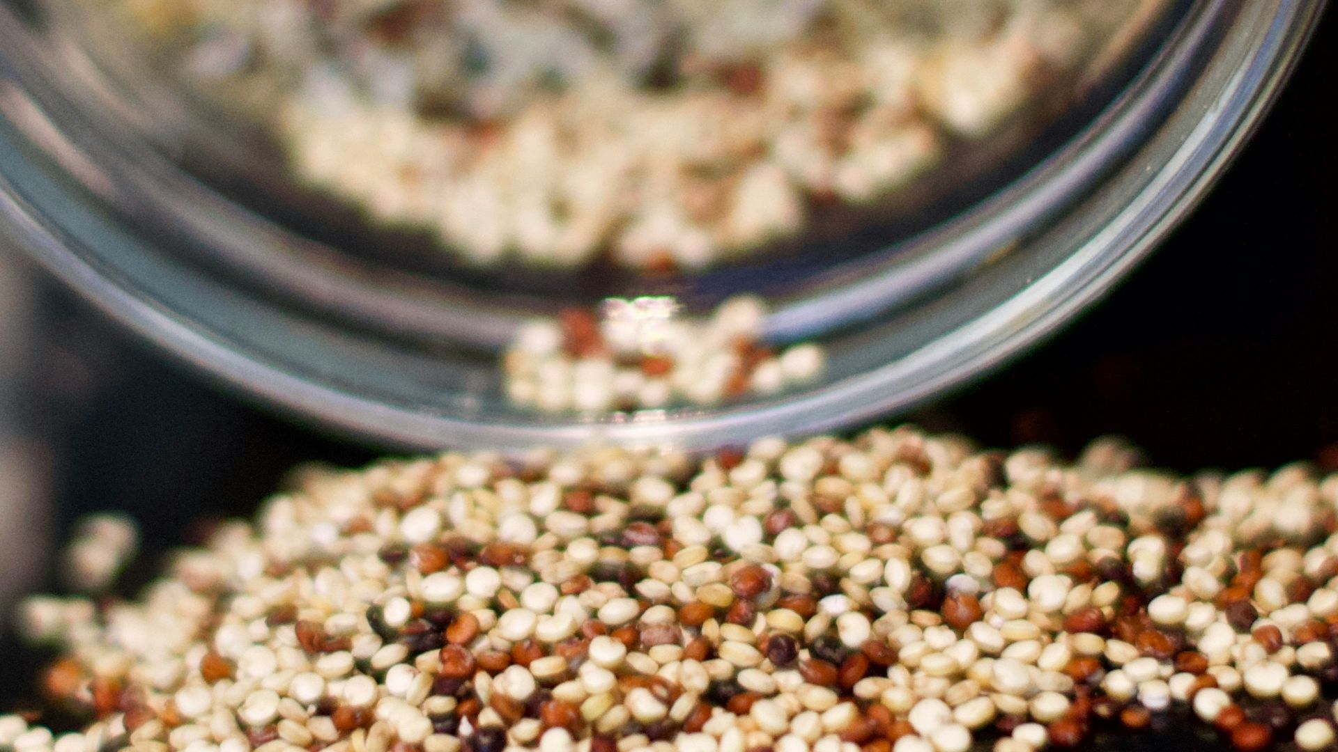 brown coffee beans in clear glass jar