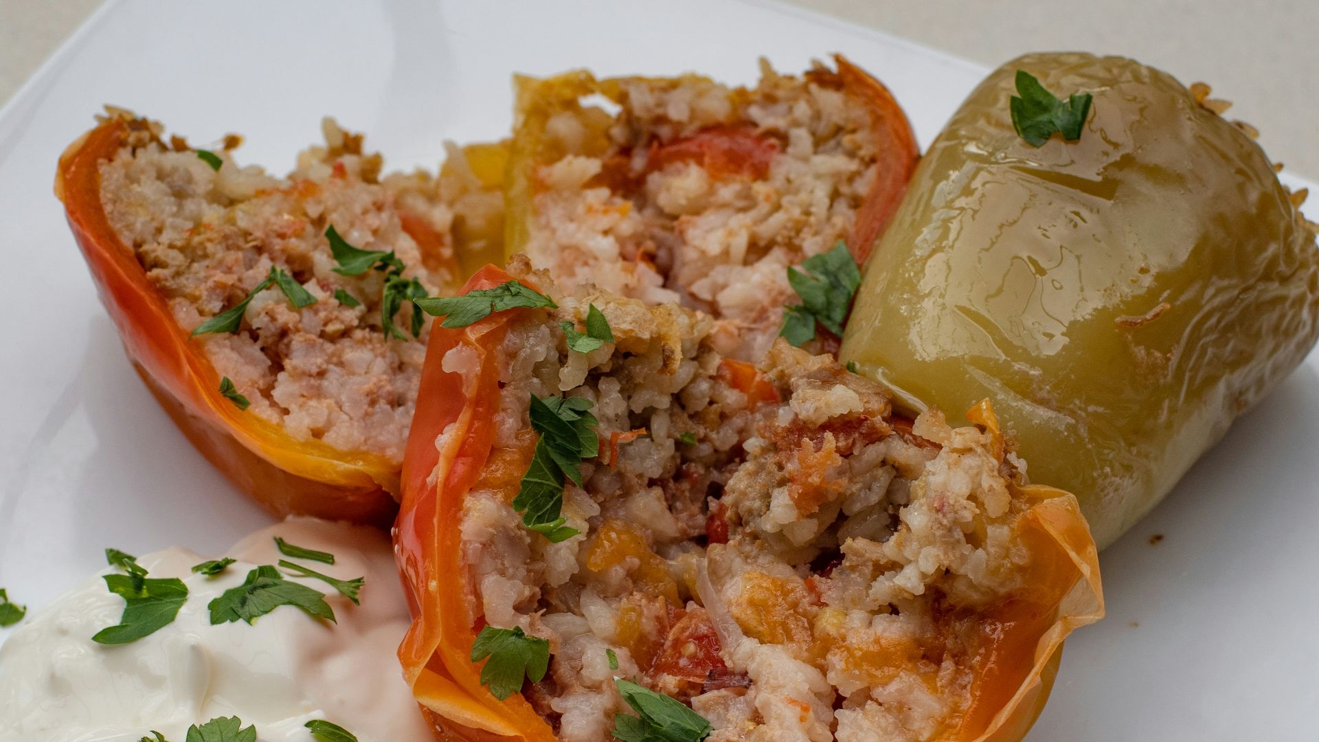 a white plate topped with stuffed bell peppers