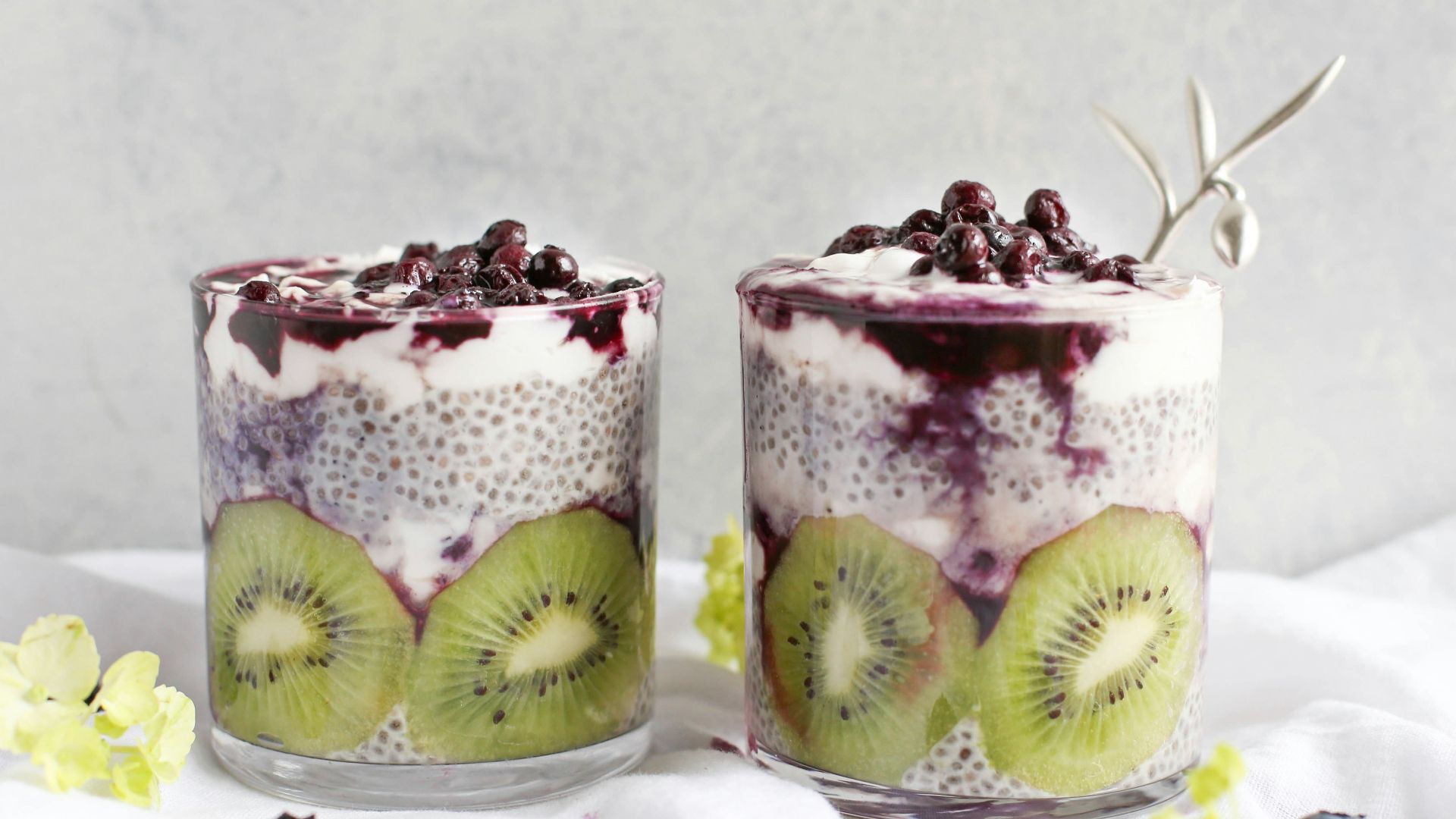 two fruit beverages on glass cups