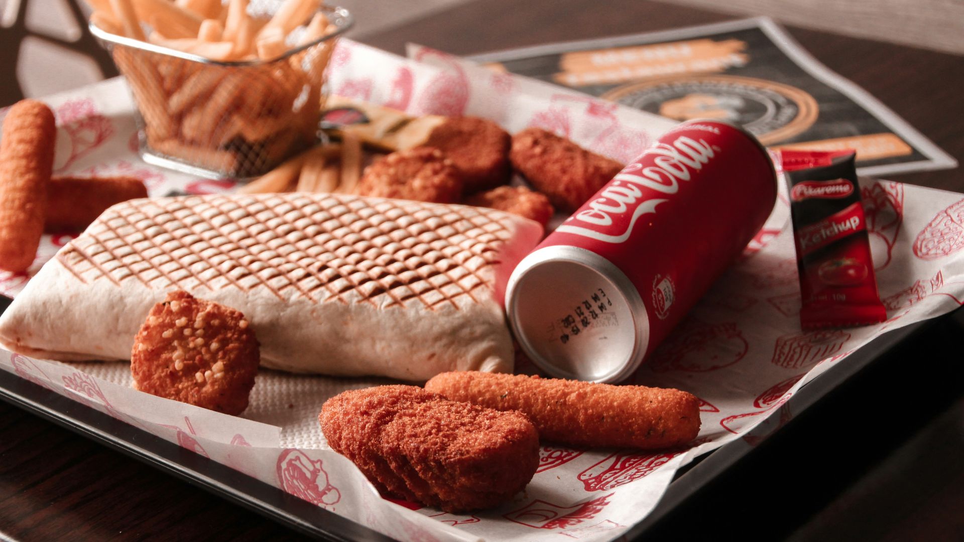 red and white coca cola can beside brown bread on white ceramic plate