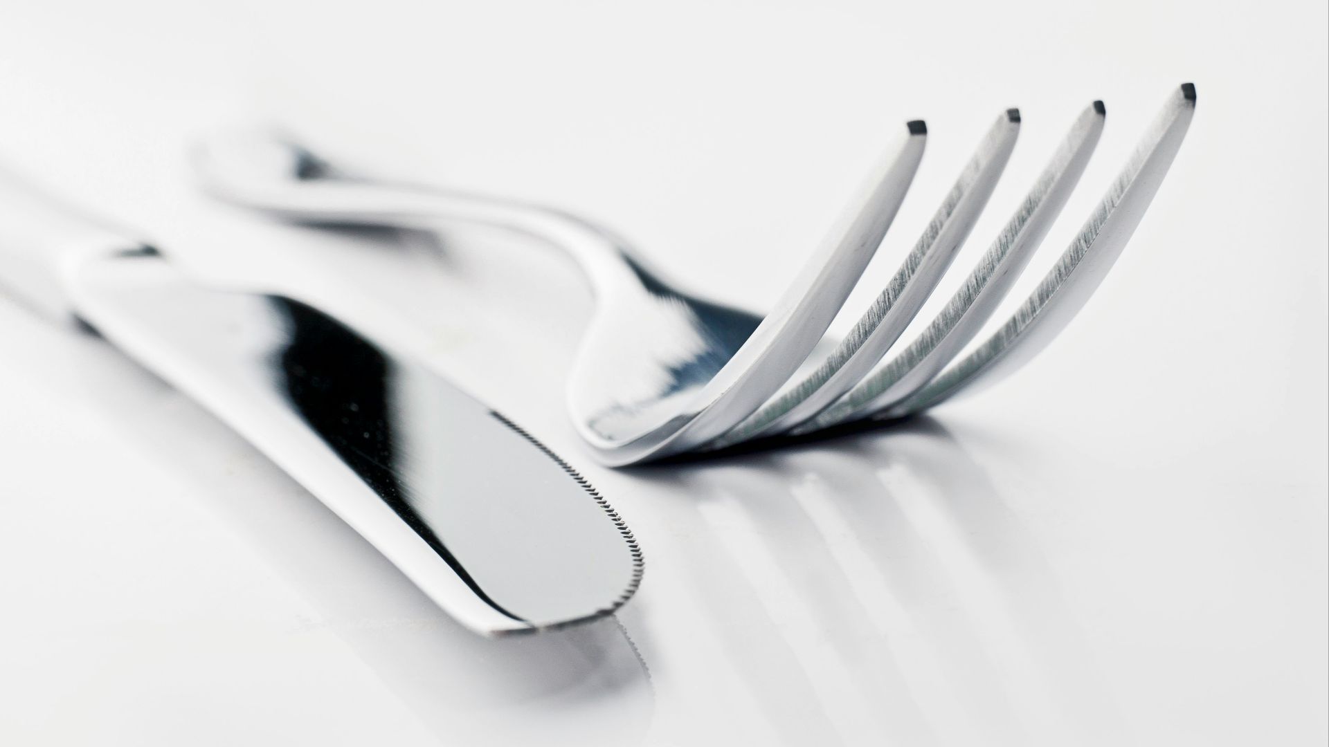 two silver bread knife and fork