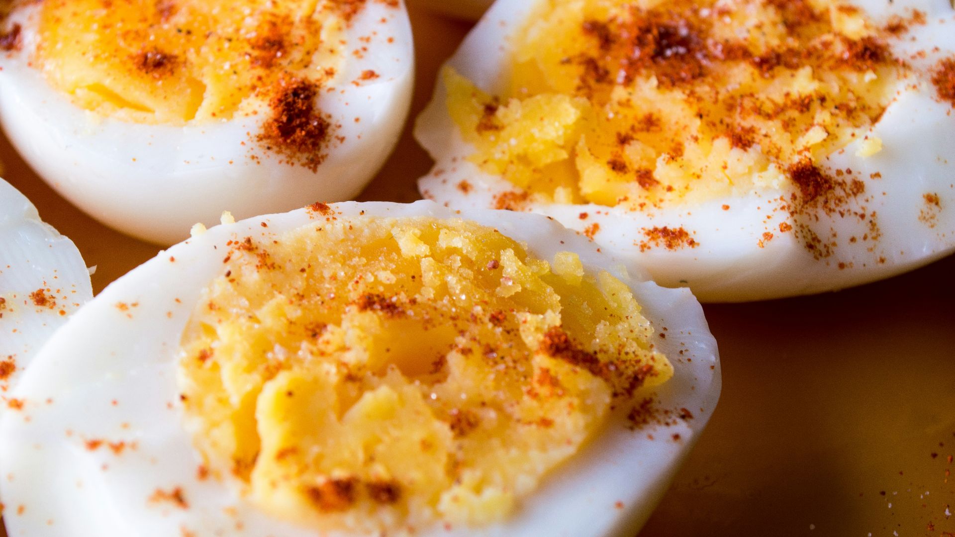 sliced boiled eggs topped with spices
