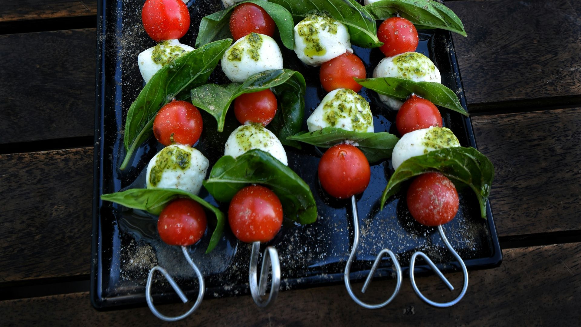 Caprese skewers with tomatoes, mozzarella, and basil