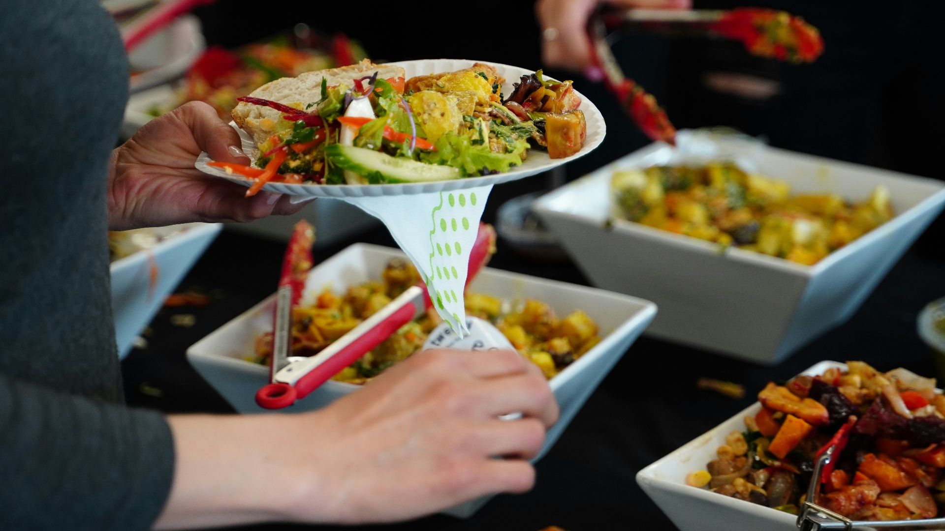 person holding white ceramic bowl with food